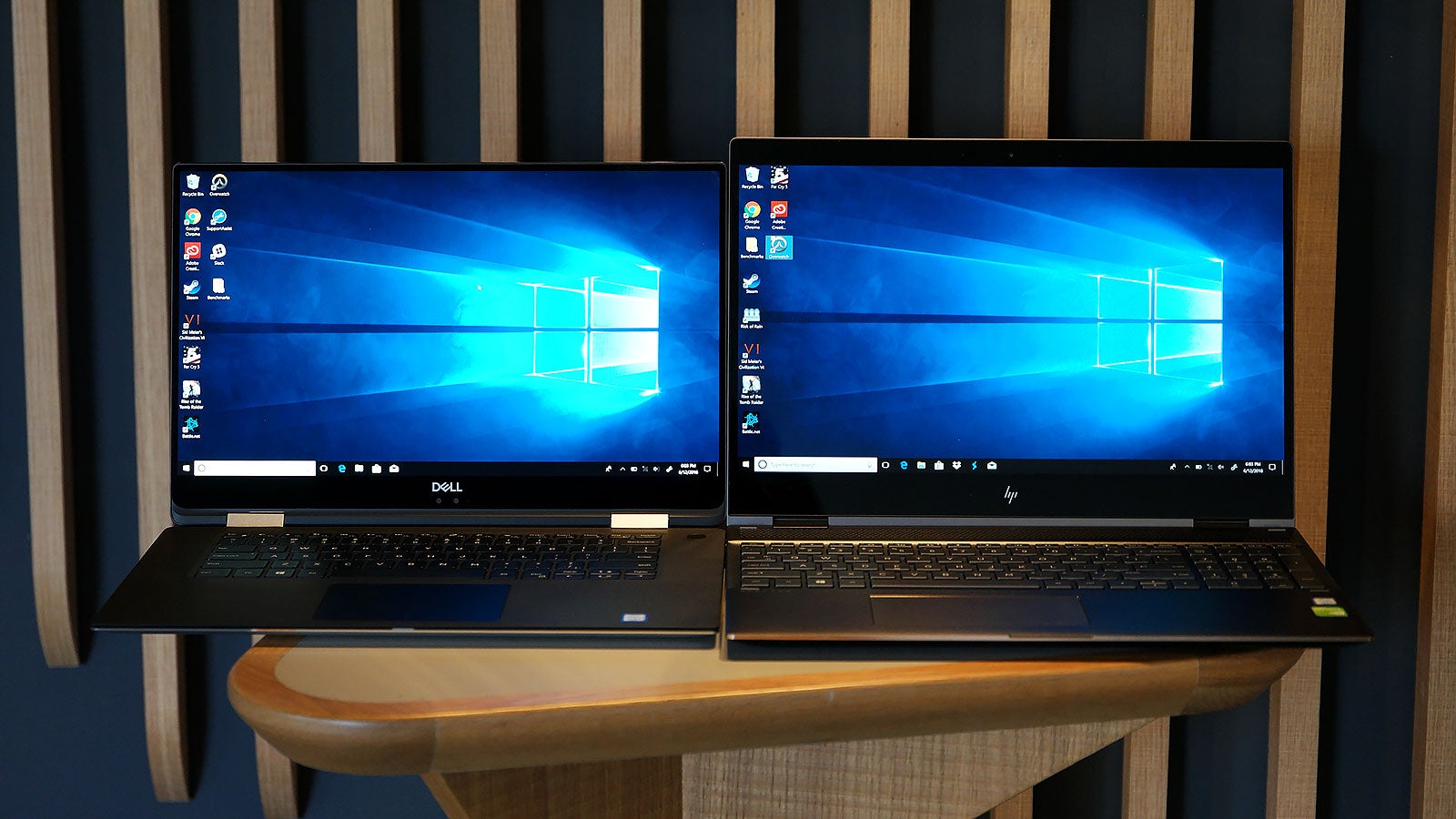 When viewed together, the Spectre’s bezels look huge, and at max brightness, the XPS’ 1080p panel puts out about 15 percent more light than Spectre’s 4K display. 