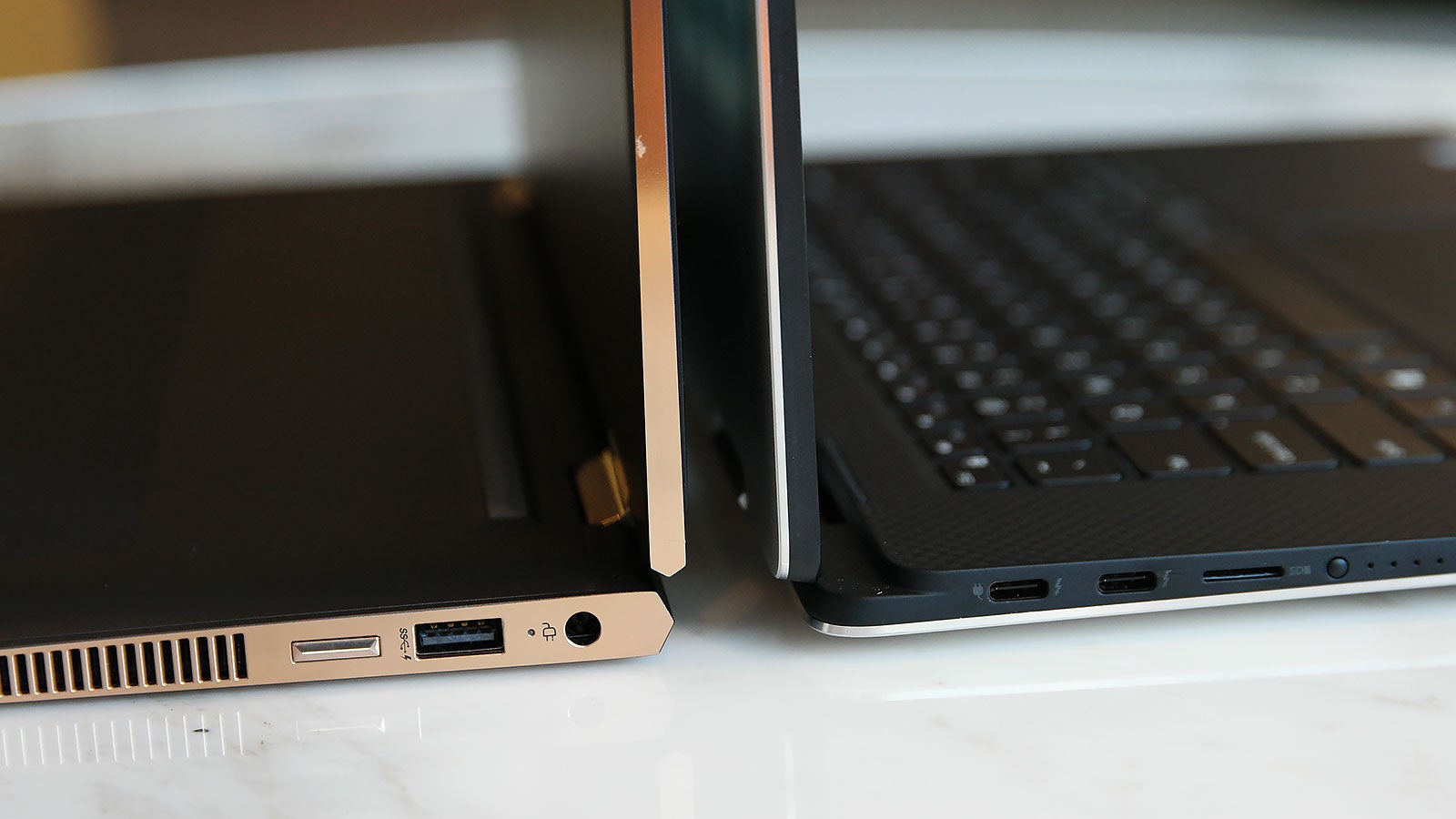 Both systems have the same number of USB ports, but the HP opted to go with two USB-C with Thunderbolt 3 and one USB Type-A (plus HDMI), while Dell gets by with three USB-C (two with Thunderbolt 3) and an included USB-A to C dongle. 