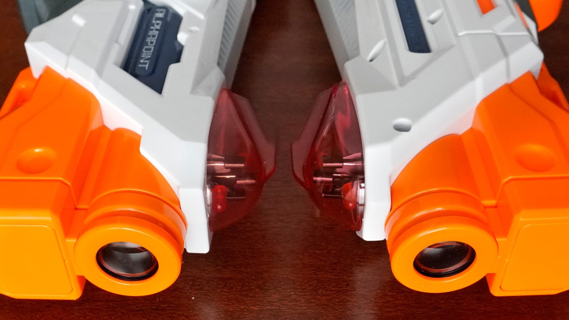 Both blasters feature IR emitters and detectors inside a protective dome on top.