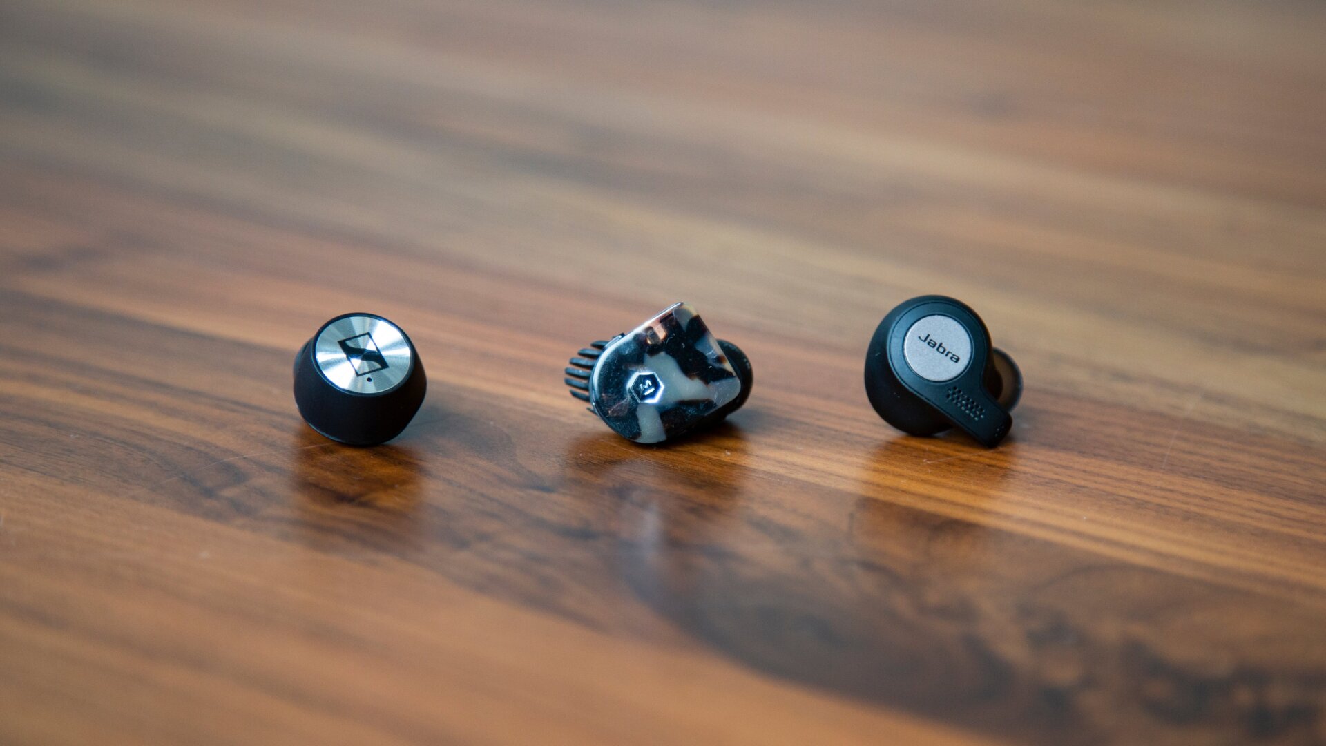 The Sennheiser Momentum True Wireless (left), the Master and Dynamic MW07 (center), and the Jabra Elite Active 65t (right)