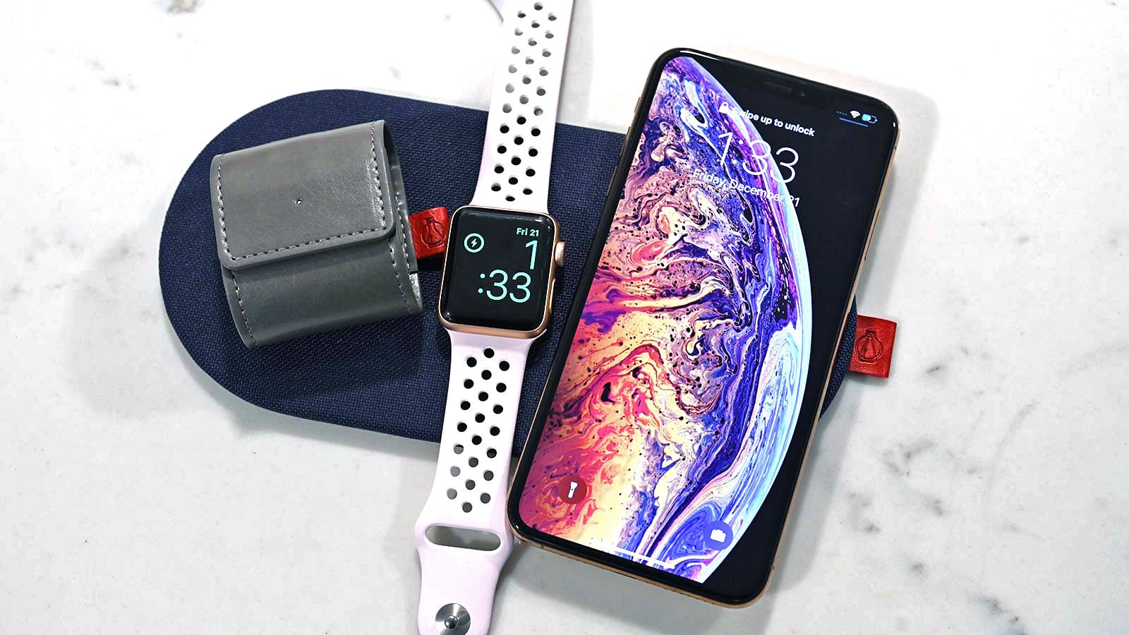 Devices with support for Qi wireless charging can go on either side, but only an Apple Watch can go in the middle.