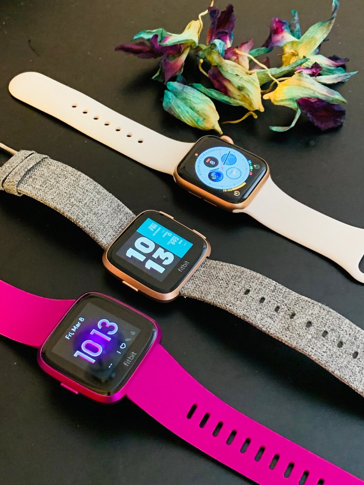 Left to right: Versa Lite, Versa, and Apple Watch Series 4. You can see why the Versa is often mistaken for an Apple Watch.