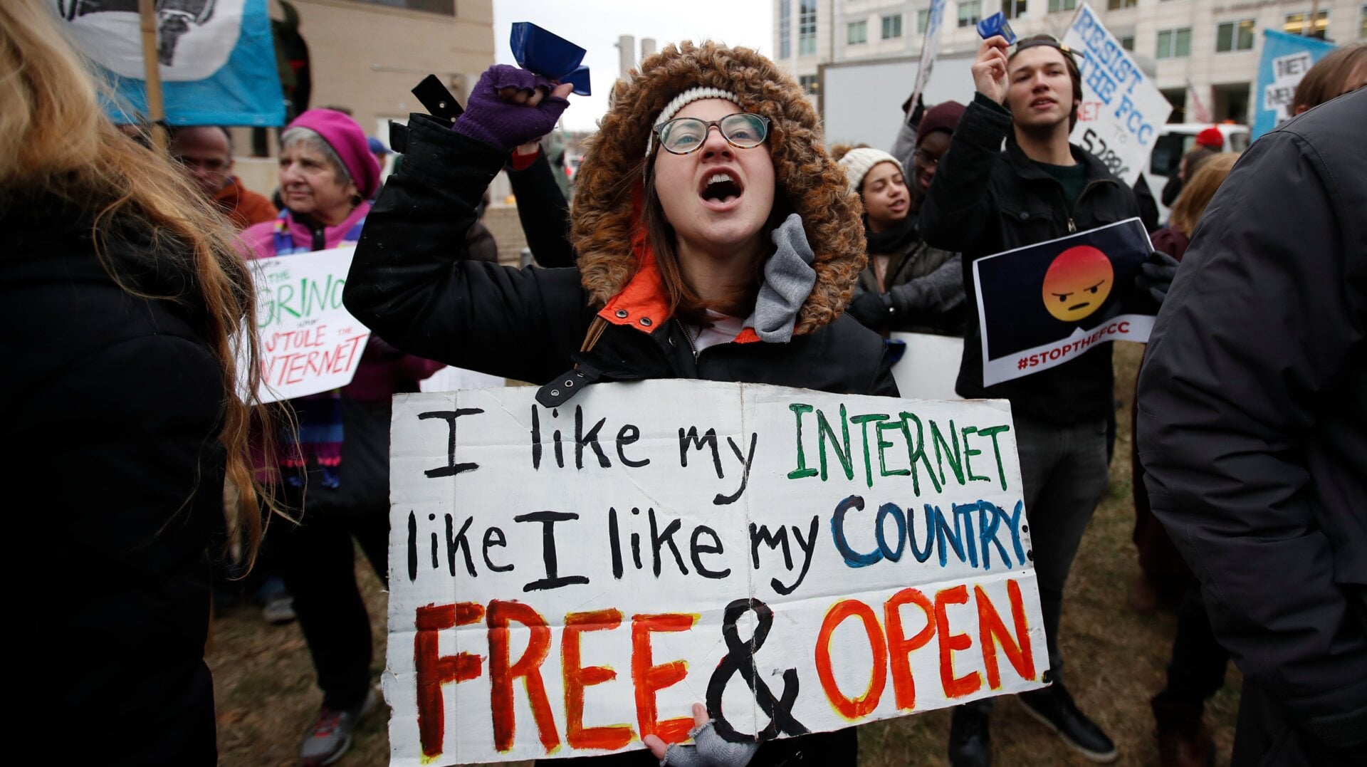 Lindsay Chestnut of Baltimore holds a sign that reads “I like My Internet Like I Like my Country: Free & Open” as she protests near the Federal Communications Commission (FCC), in Washington where the FCC was scheduled to meet and vote on net neutrality on Dec. 14, 2017.