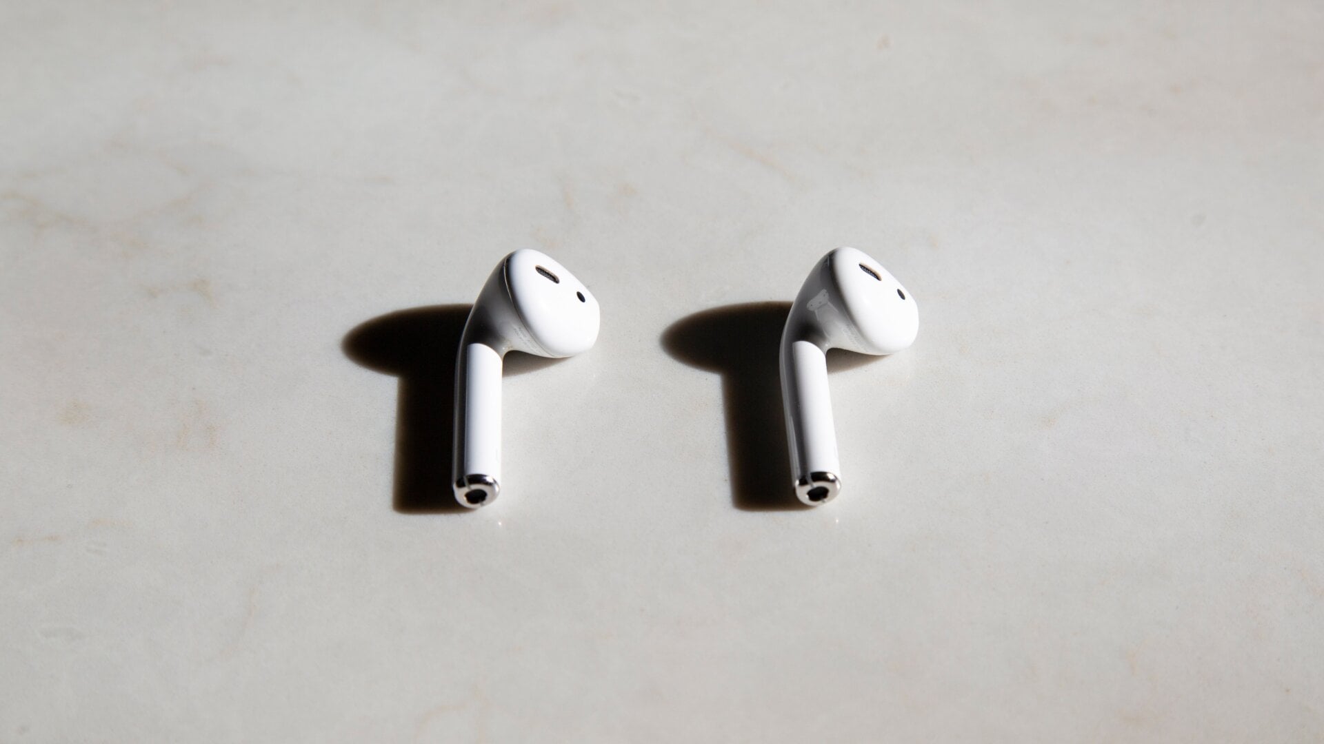 Here’s a first generation AirPod (left) next to a second generation AirPod (right). Can you spot the difference? This is a trick question.