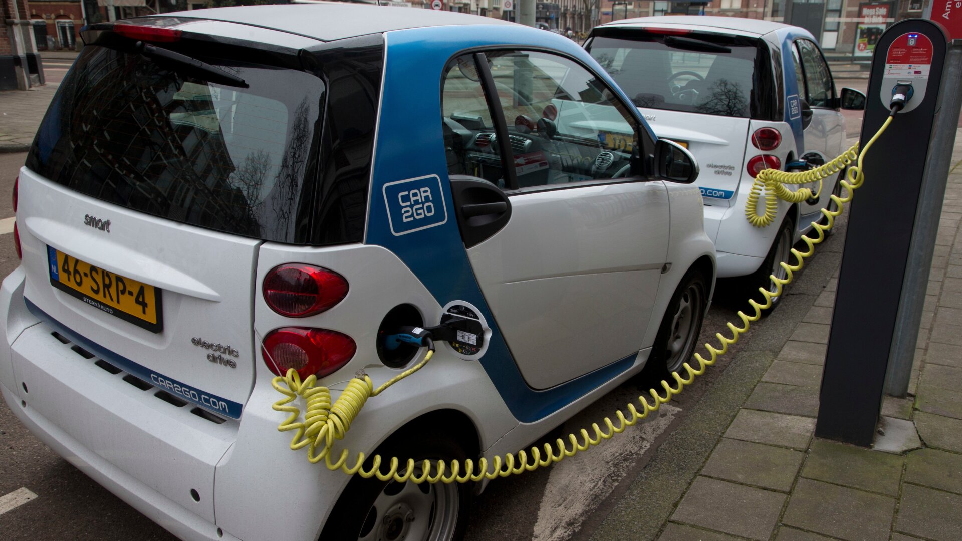 Car2Go Smart car rentals parked on the streets of Amsterdam in 2013.