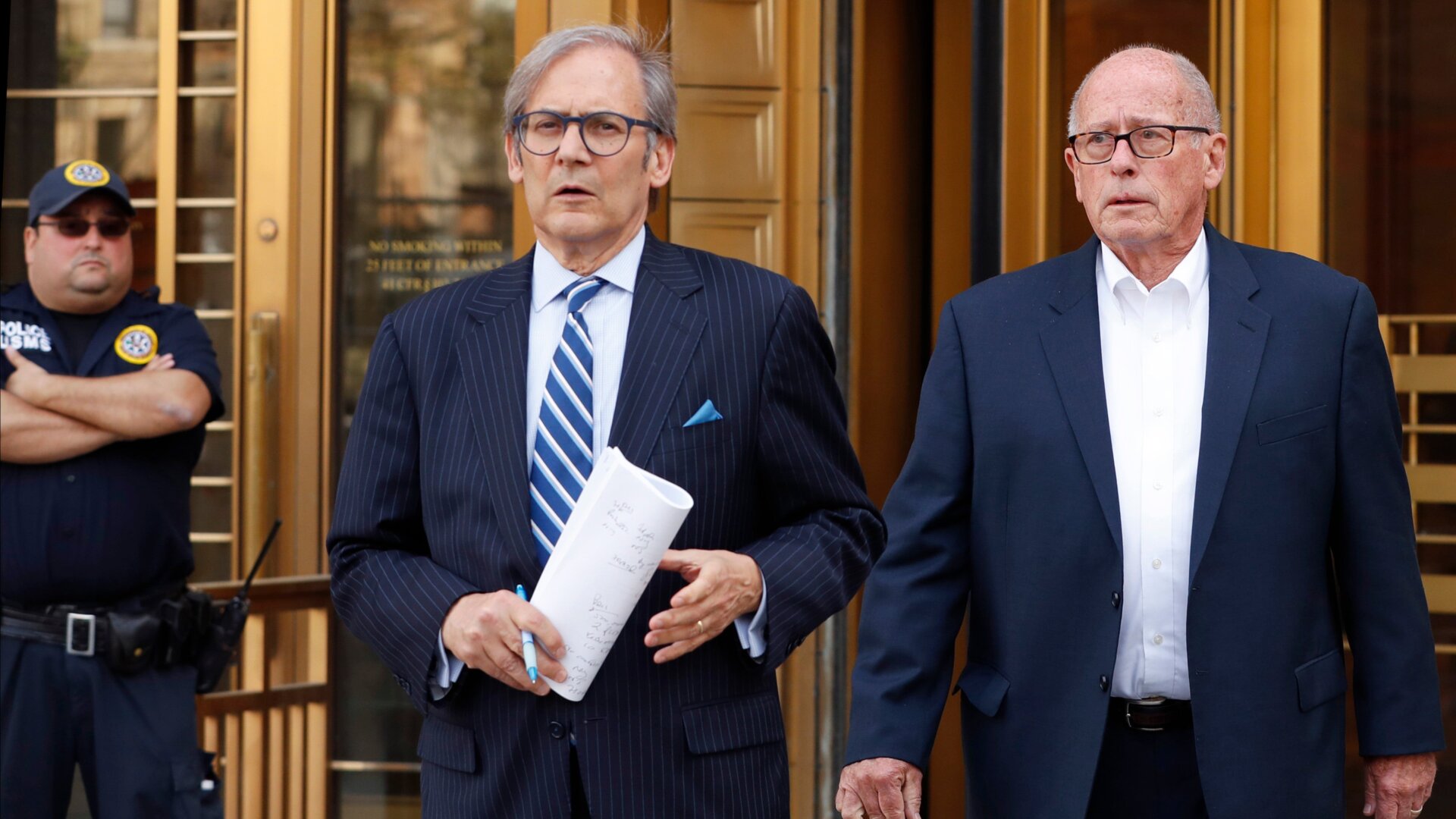 Former Rochester Drug Co-Operative CEO Laurence Doud III, right, leaving U.S. District Court in Manhattan with his attorney Robert C. Gottlieb, center, on April 23, 2019.