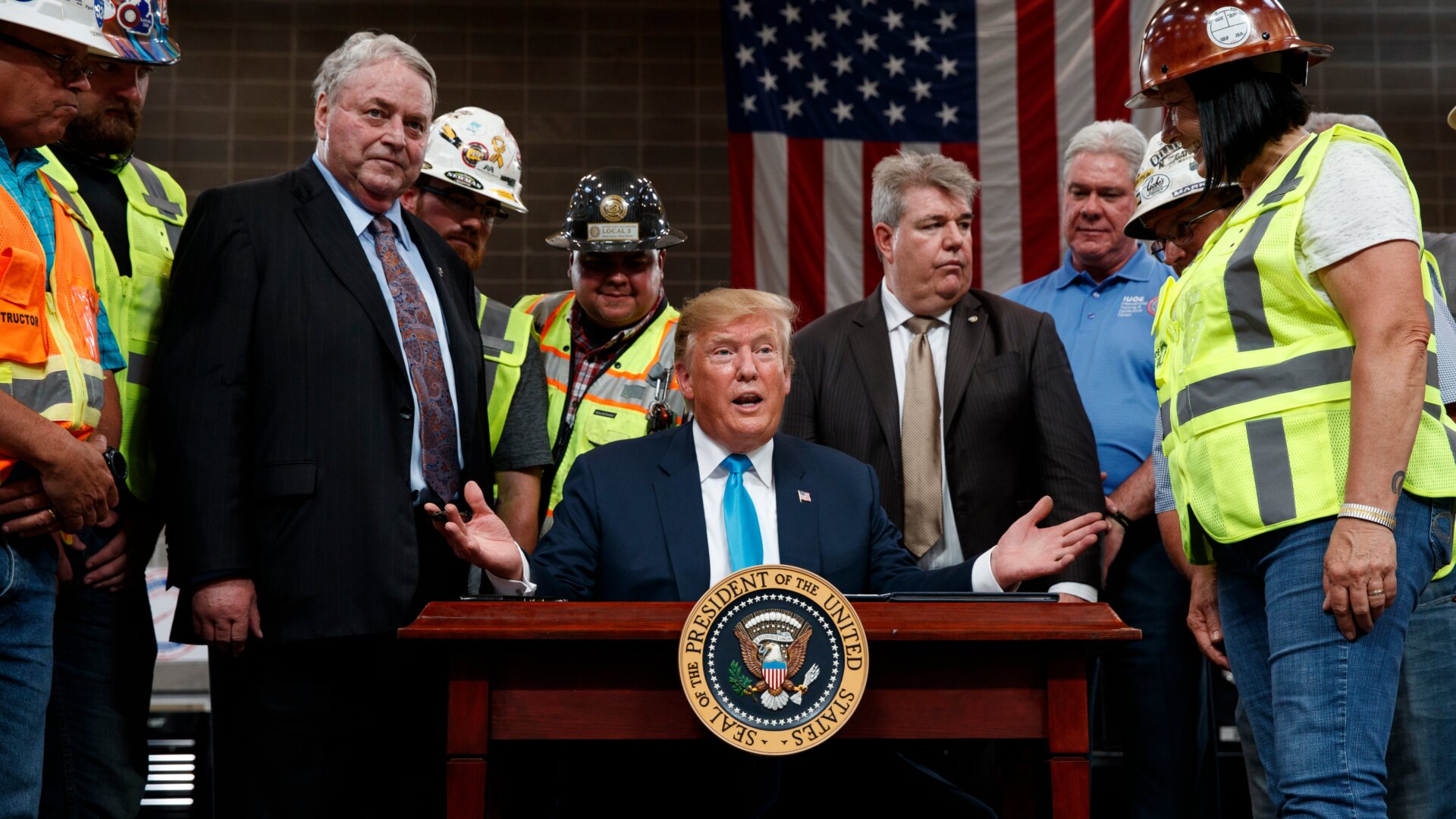 Here is the president signing the orders.