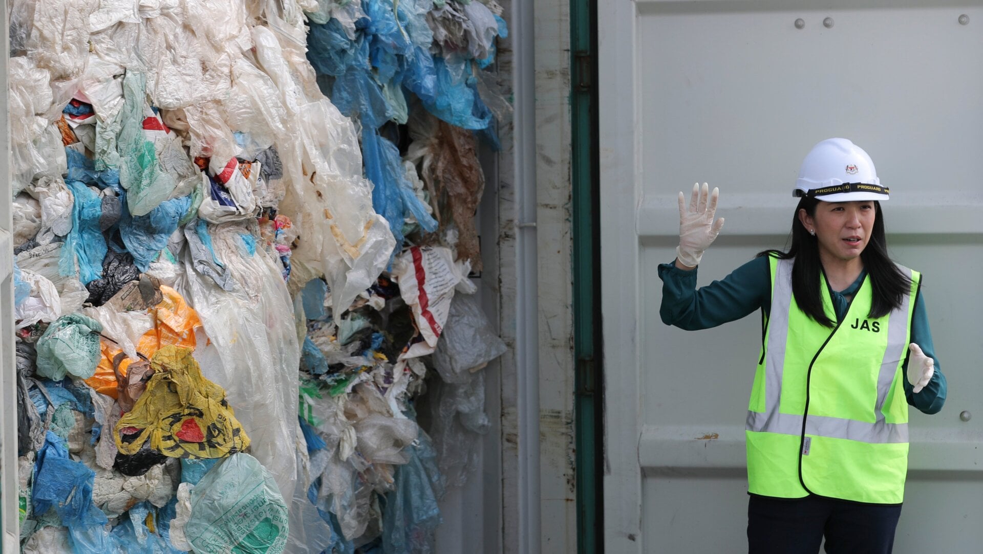 Malaysia’s Minister of Energy, Science, Technology, Environment and Climate Change Yeo Bee Yin shows plastic waste shipment in Port Klang, Malaysia.