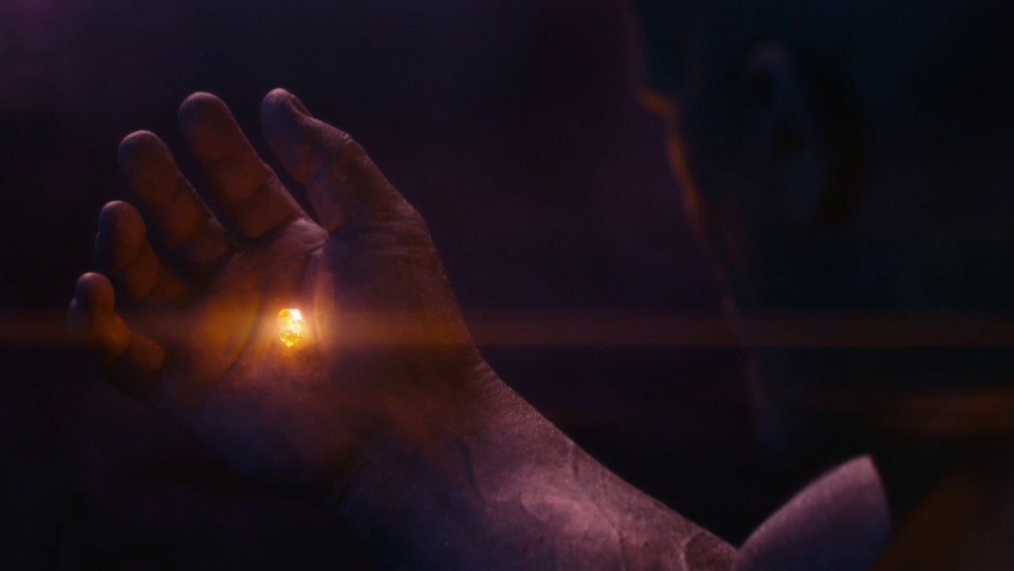 Thanos clutching the Soul Stone on Vormir.