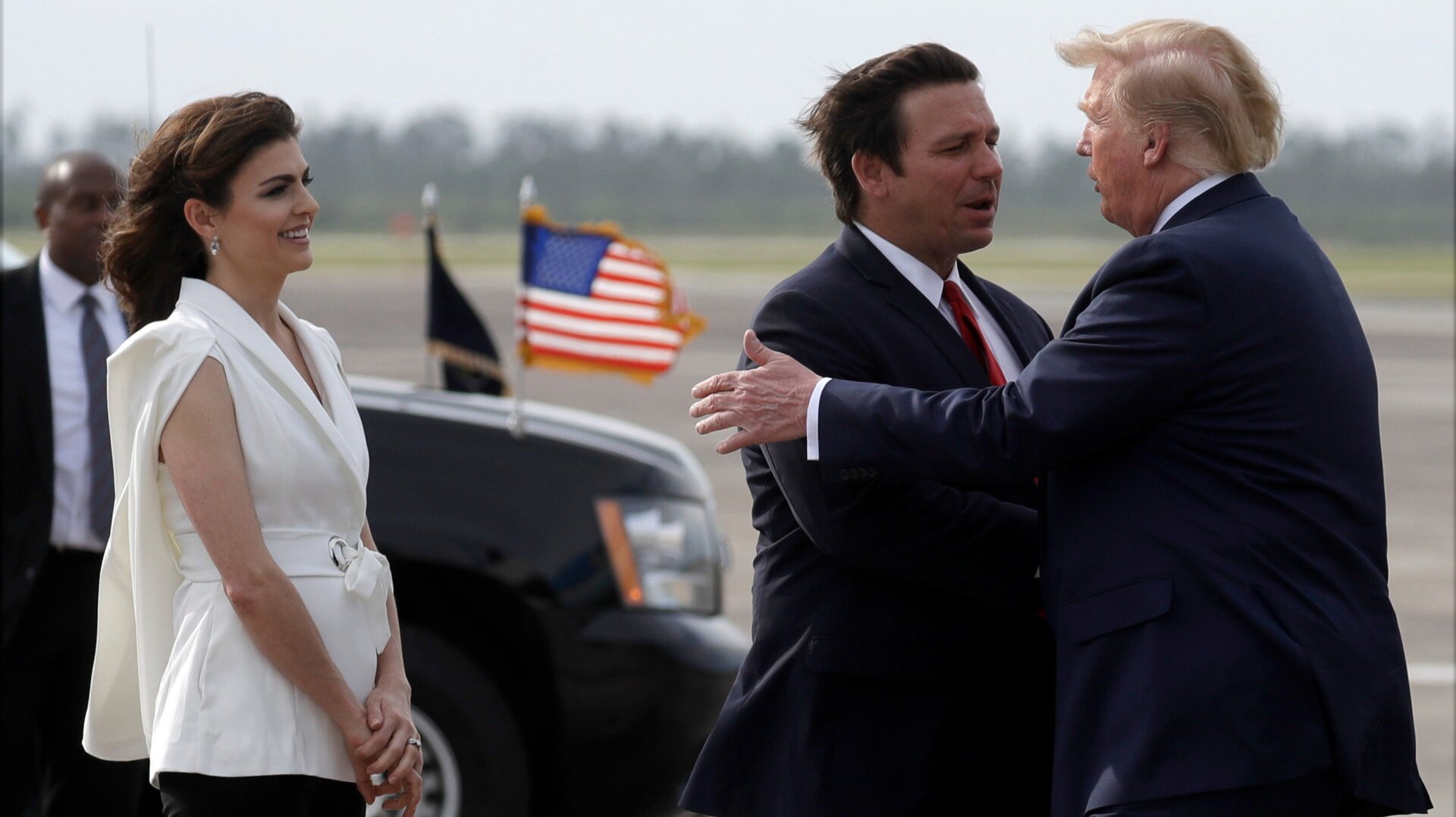 President Donald Trump shakes hands with Florida Gov. Ron DeSantis as he arrives at Tyndall Air Force Base to view damage from Hurricane Michael, and attend a political rally, Wednesday, May 8, 2019.