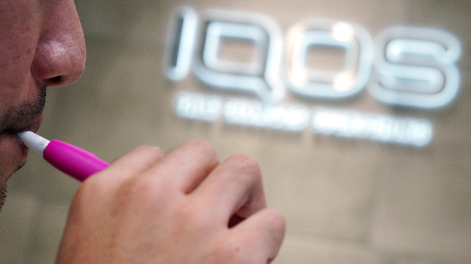 A customer at an IQOS store in Tokyo in 2018.