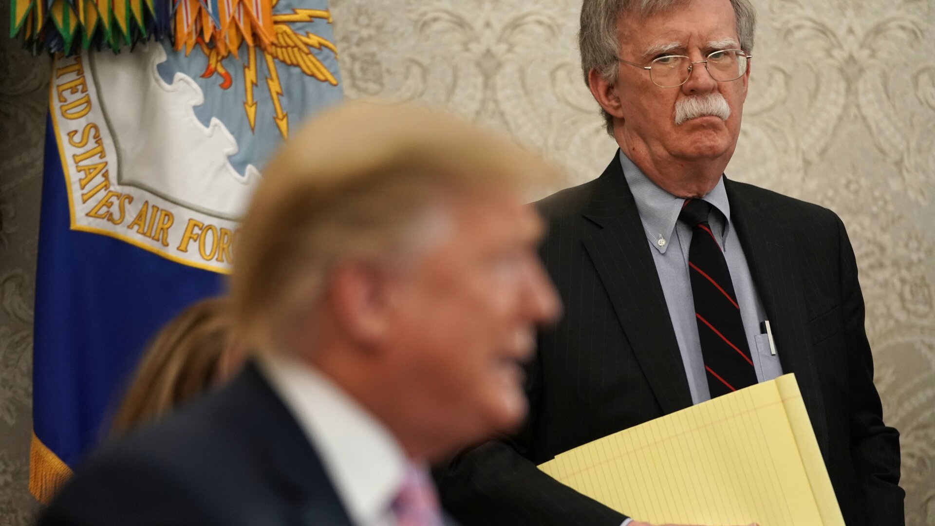 National Security Adviser John Bolton listens to U.S. President Donald Trump speak during a meeting with Egyptian President Abdel-Fattah el-Sisi in the Oval Office of the White House April 9, 2019 in Washington, DC.