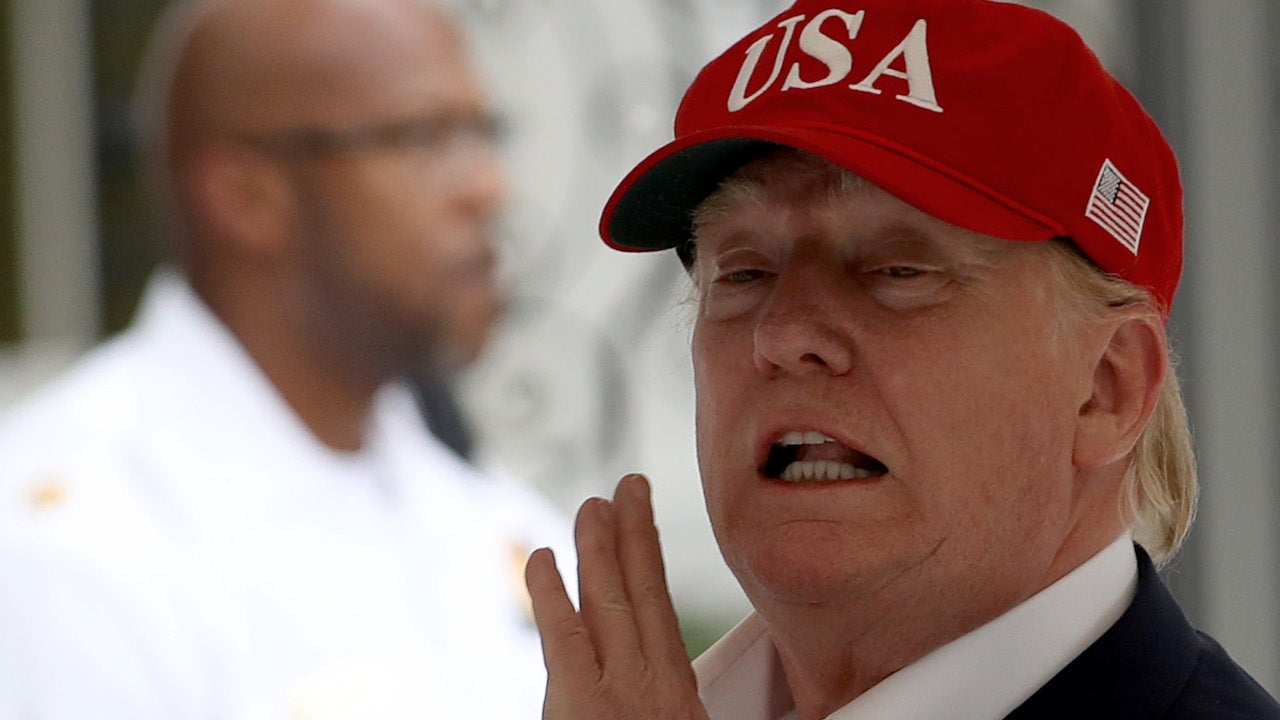 President Donald Trump shouts to reporters while returning to the White House on June 7, 2019, in Washington, DC.