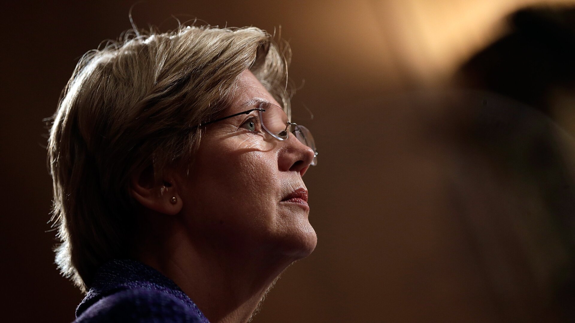 Sen. Elizabeth Warren (D-MA) listens as Consumer Financial Protection Bureau Director Richard Cordray testifies before the Senate Banking, Housing and Urban Affairs Committee November 12, 2013 in Washington, DC.