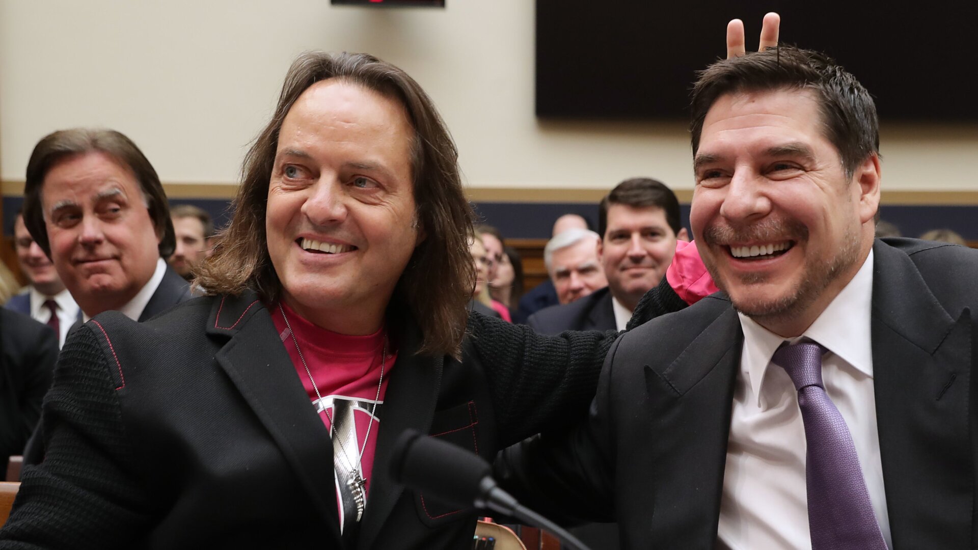 T-Mobile CEO John Legere and Executive Director of Sprint Marcelo Claure pose for photographs before testifying to the House Judiciary Committee’s Antitrust, Commercial and Administrative Law Subcommittee on Capitol Hill, March 12, 2019 in Washington, DC.