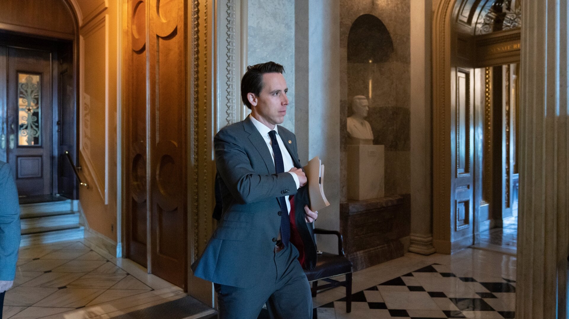 Sen. Josh Hawley, R-Mo., leaves the Senate floor after presiding over the longest roll call in history, an amendment to require approval from Congress before President Donald Trump could order military strikes against Iran, at the Capitol in Washington, Friday, June 28, 2019.