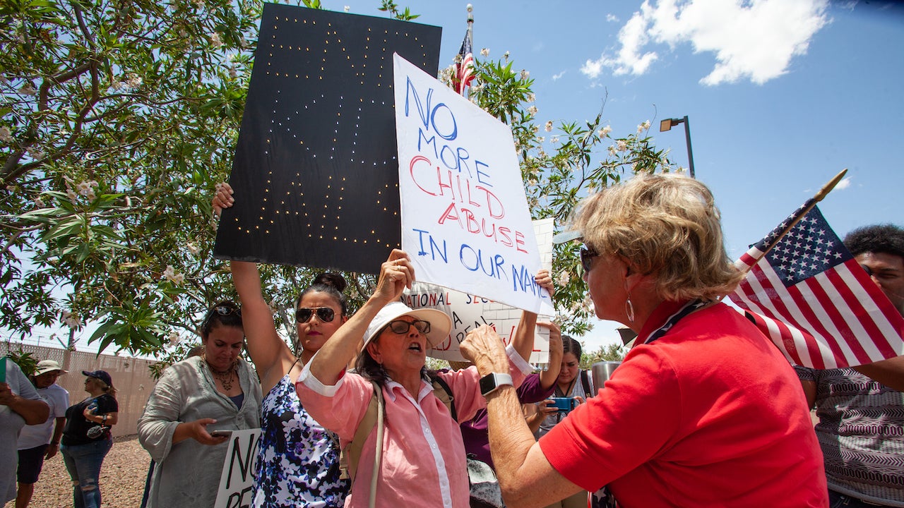 Retired school teacher Carmen Rubio from El Paso (center) argues with a so-called “counter protester” outside of the Clint Border Patrol station on July 1, 2019 in Clint, Texas.