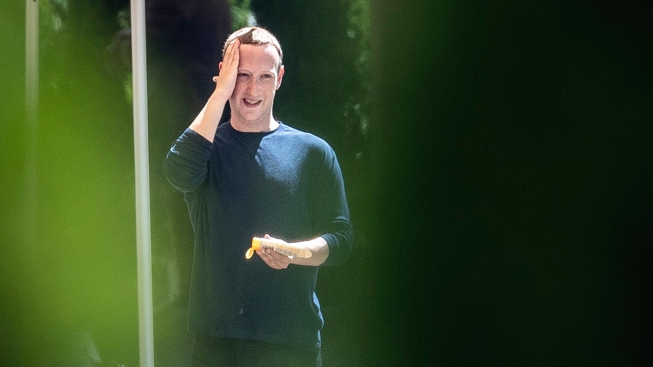 Human billionaire Mark Zuckerberg applies sunscreen to his human head using his human hand at the annual Sun Valley Conference on July 12, 2019 in Sun Valley, Idaho.