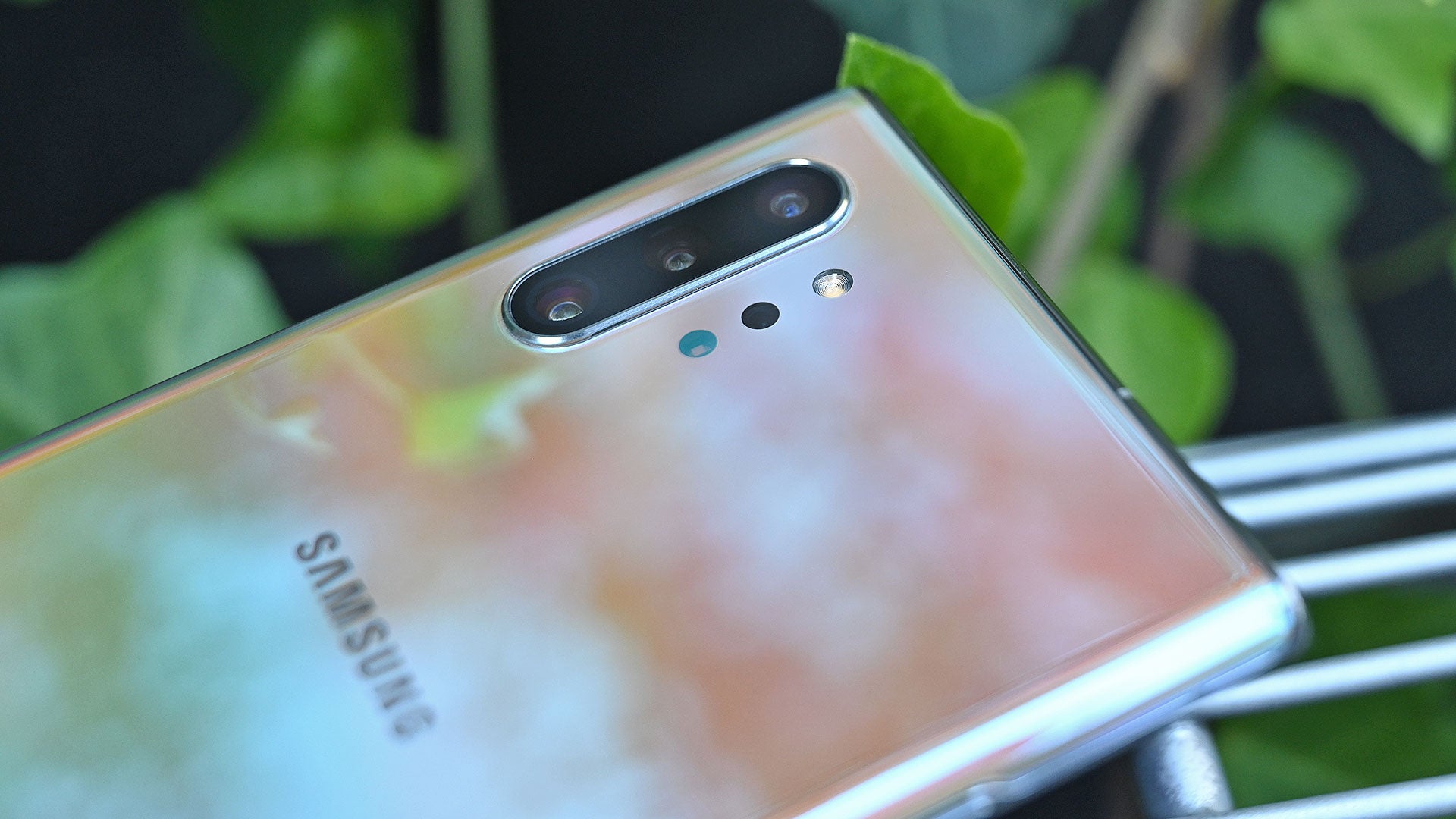 If you look close, you can see a tiny microphone hole at the base of the camera module next to the bottom-most camera. 