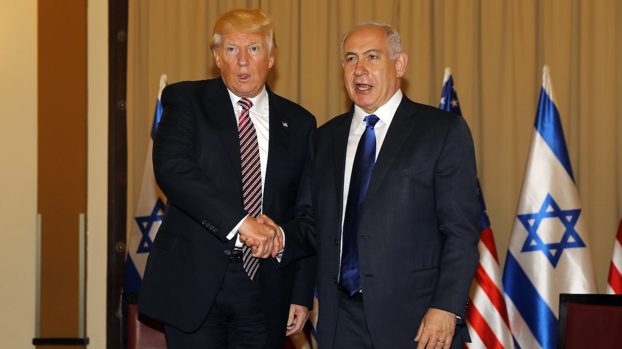 President Donald Trump awkwardly shakes hands with Israel’s Prime Minister Benjamin Netanyahu during a meeting in Jerusalem on May 22, 2017.