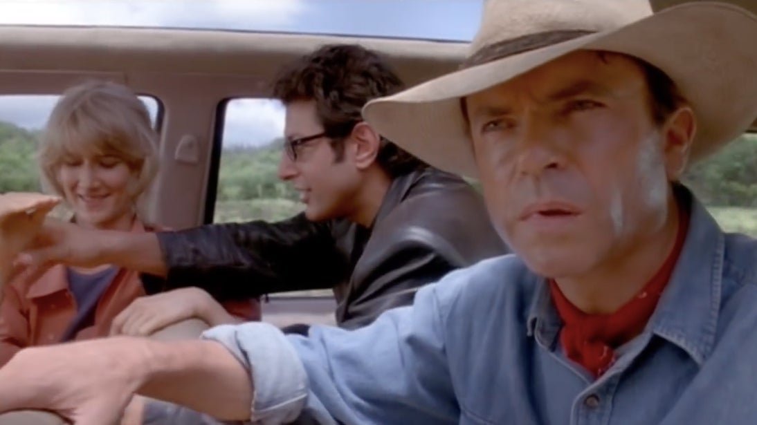 Ellie Sattler and Ian Malcolm messing around in the car while Alan Grant gets an idea.