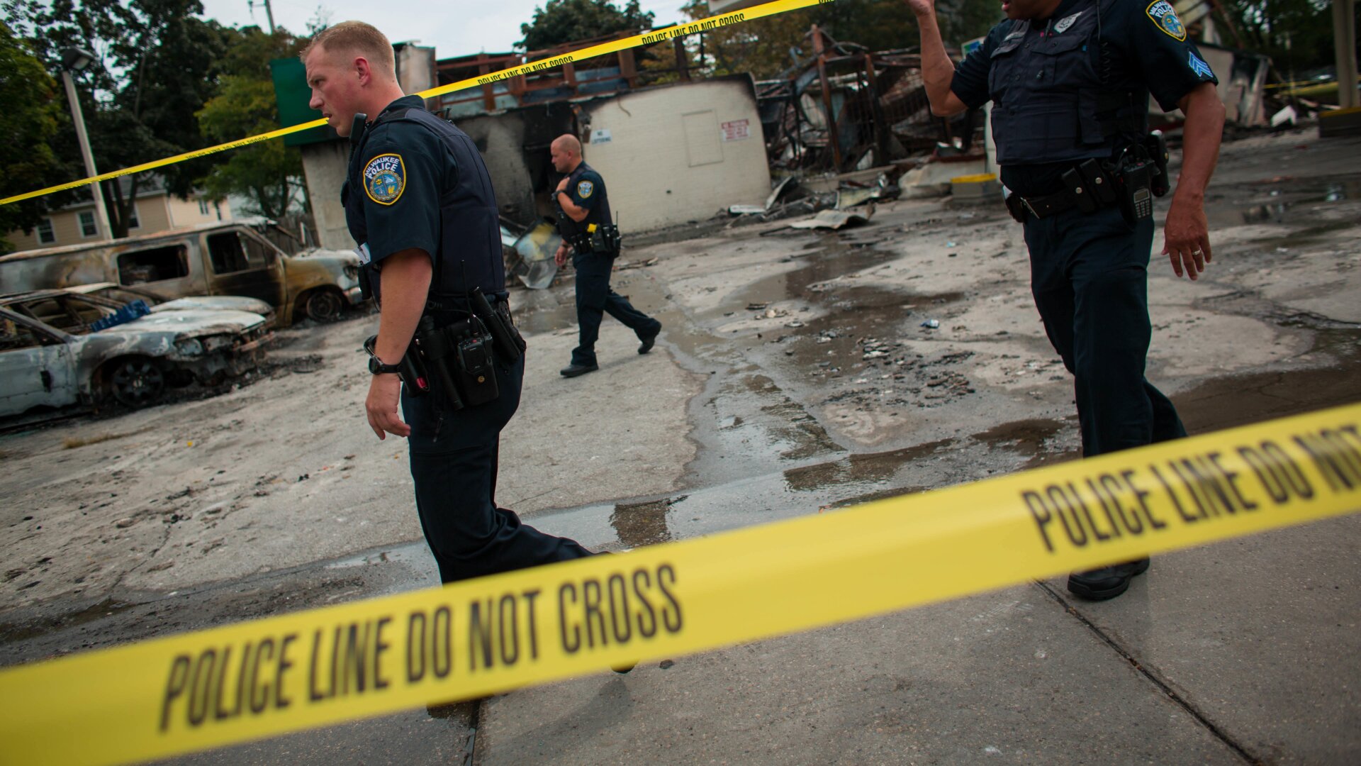 Police officers patrol the BP gas station following a shooting death by police August 15, 2016 in Milwaukee, Wisconsin.