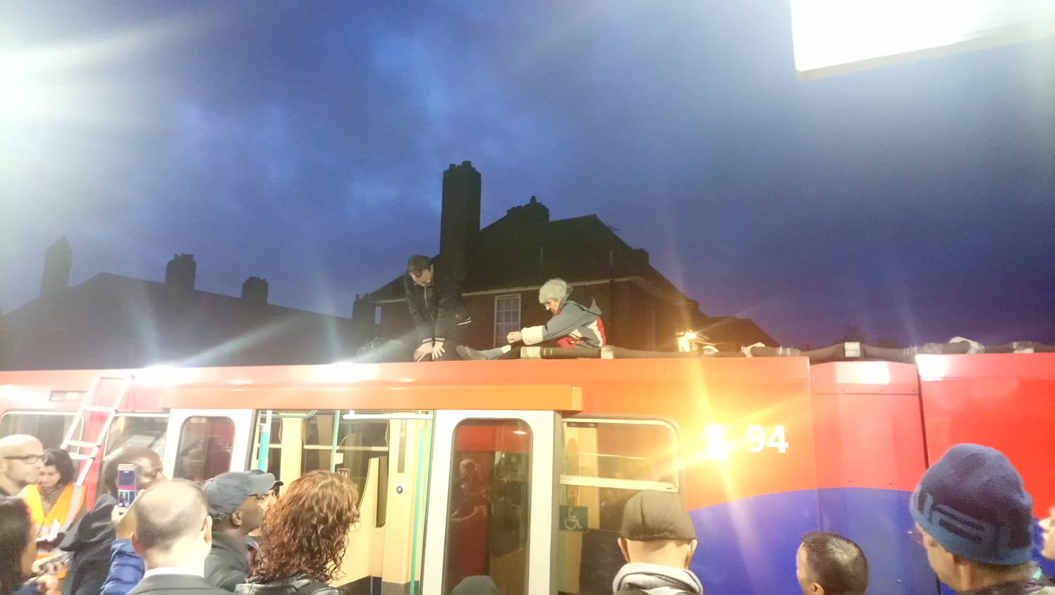 Climate protesters glue themselves on the top of a Tube train on Thursday morning.