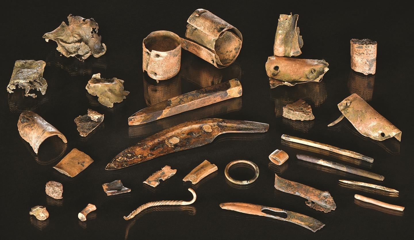 Some of the key items found in the personal pouch or case of a warrior who fought—and possibly died—in a Bronze Age battle some 3,300 years ago.