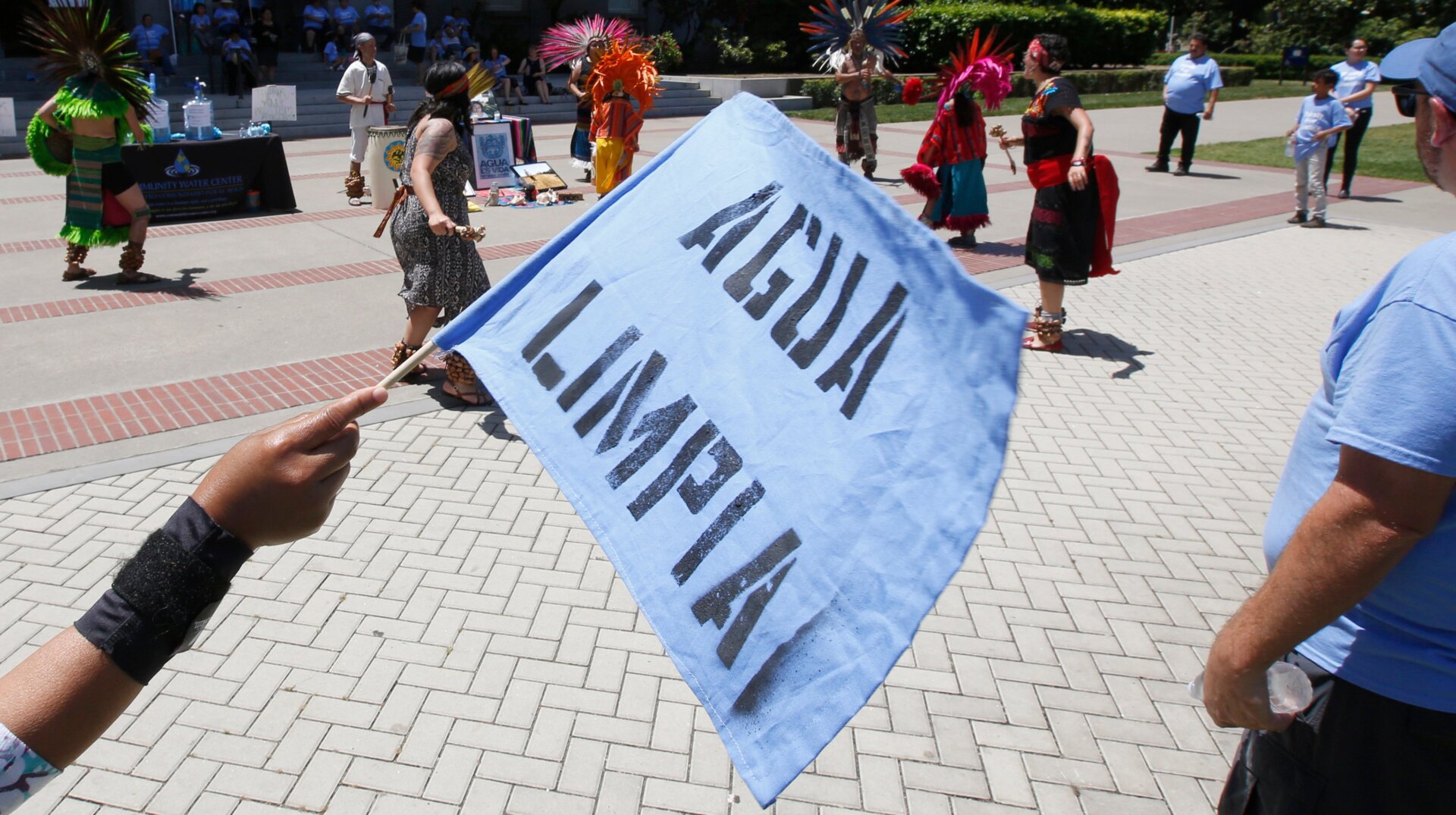 A sign at a protest in California reads, “Clean water.”