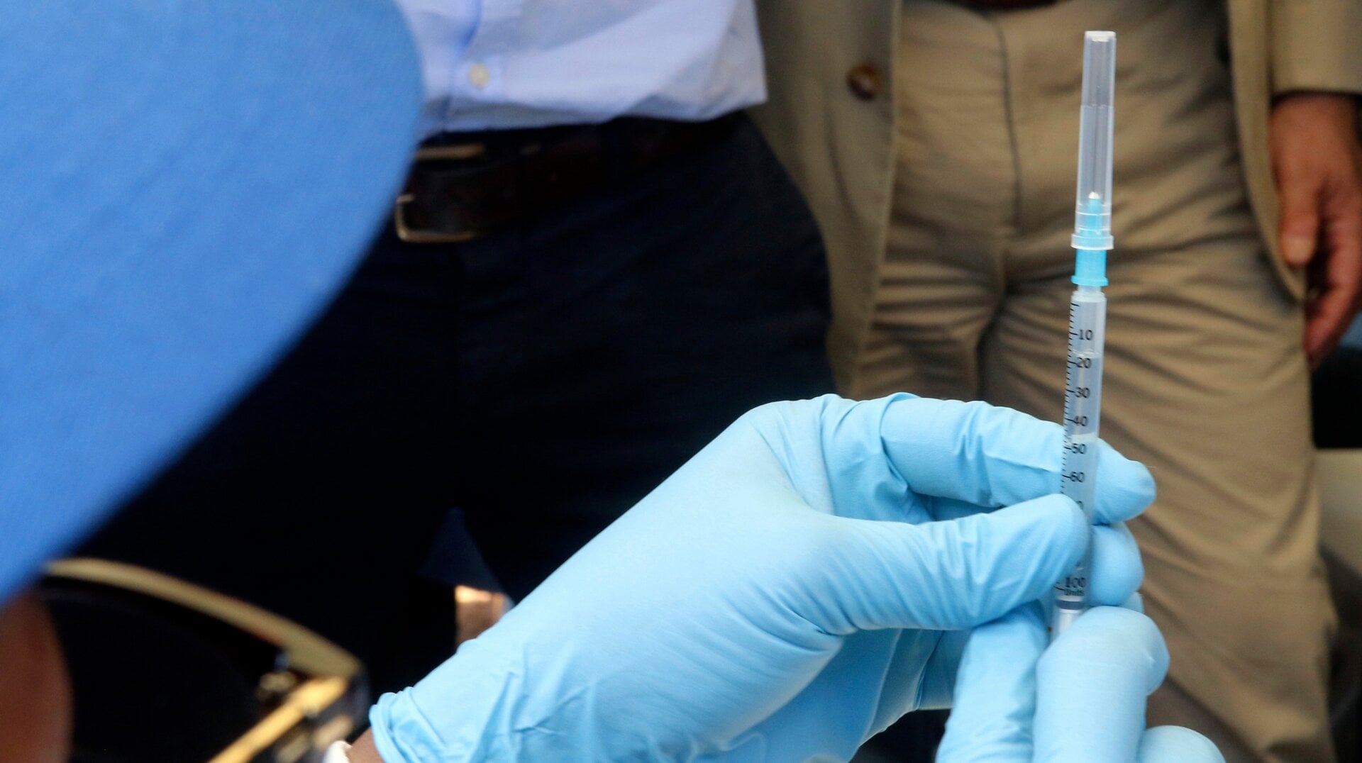 A health worker in the DRC preparing to give an experimental dose of Ervebo.