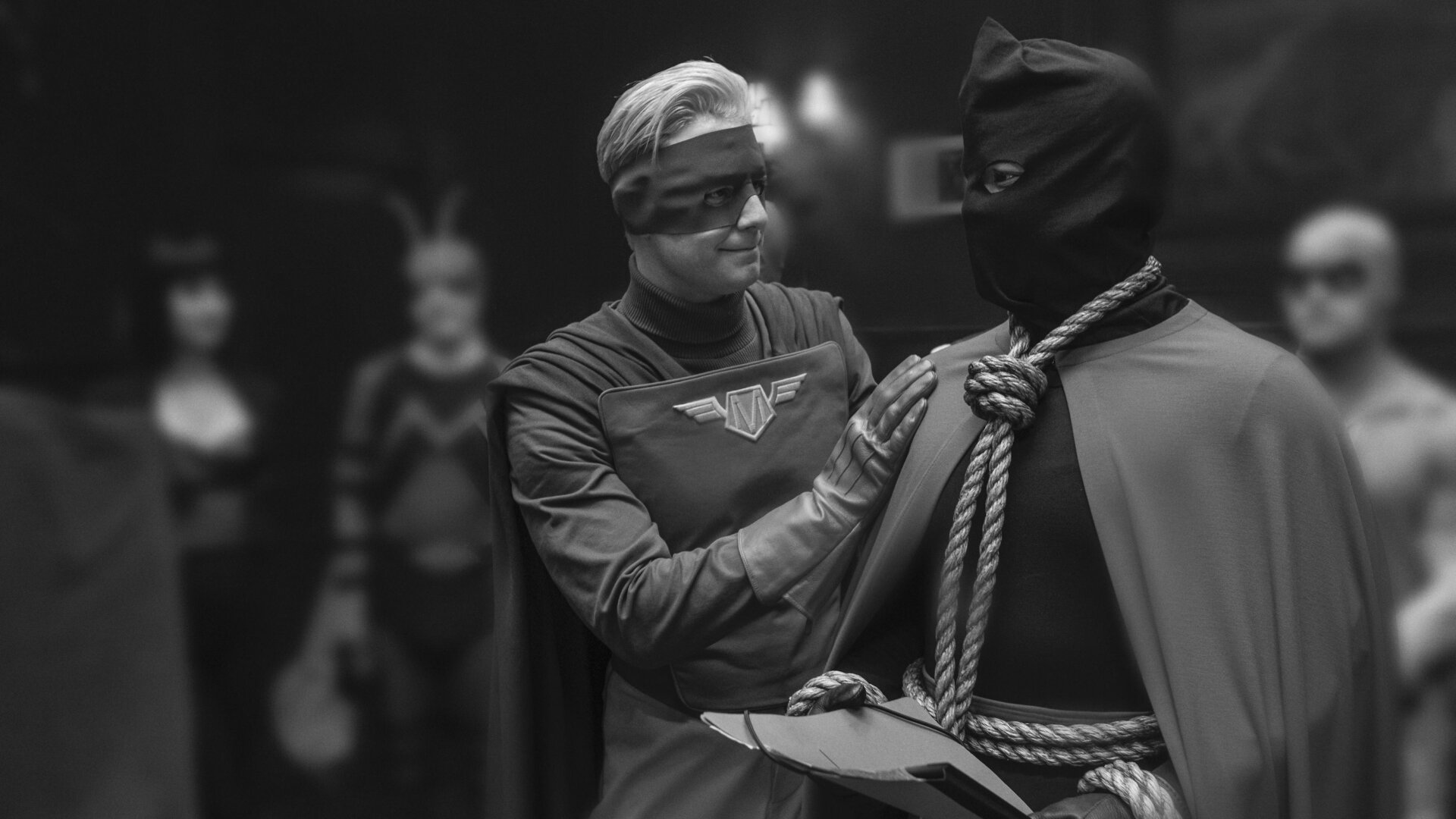 Captain Metropolis and Hooded Justice at a Minutemen press conference.