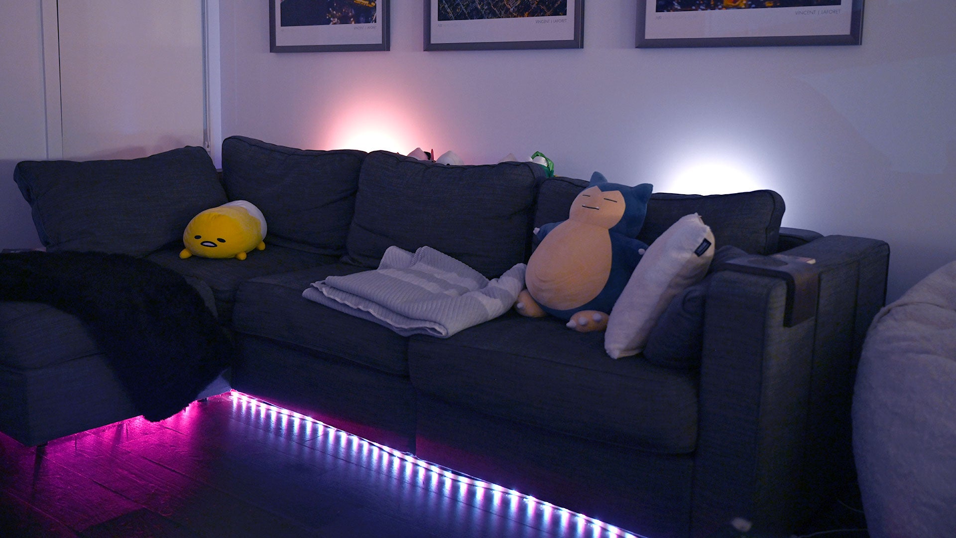 Using the Hue Sync app, you can basically set up lights anywhere in your room, including behind you. 