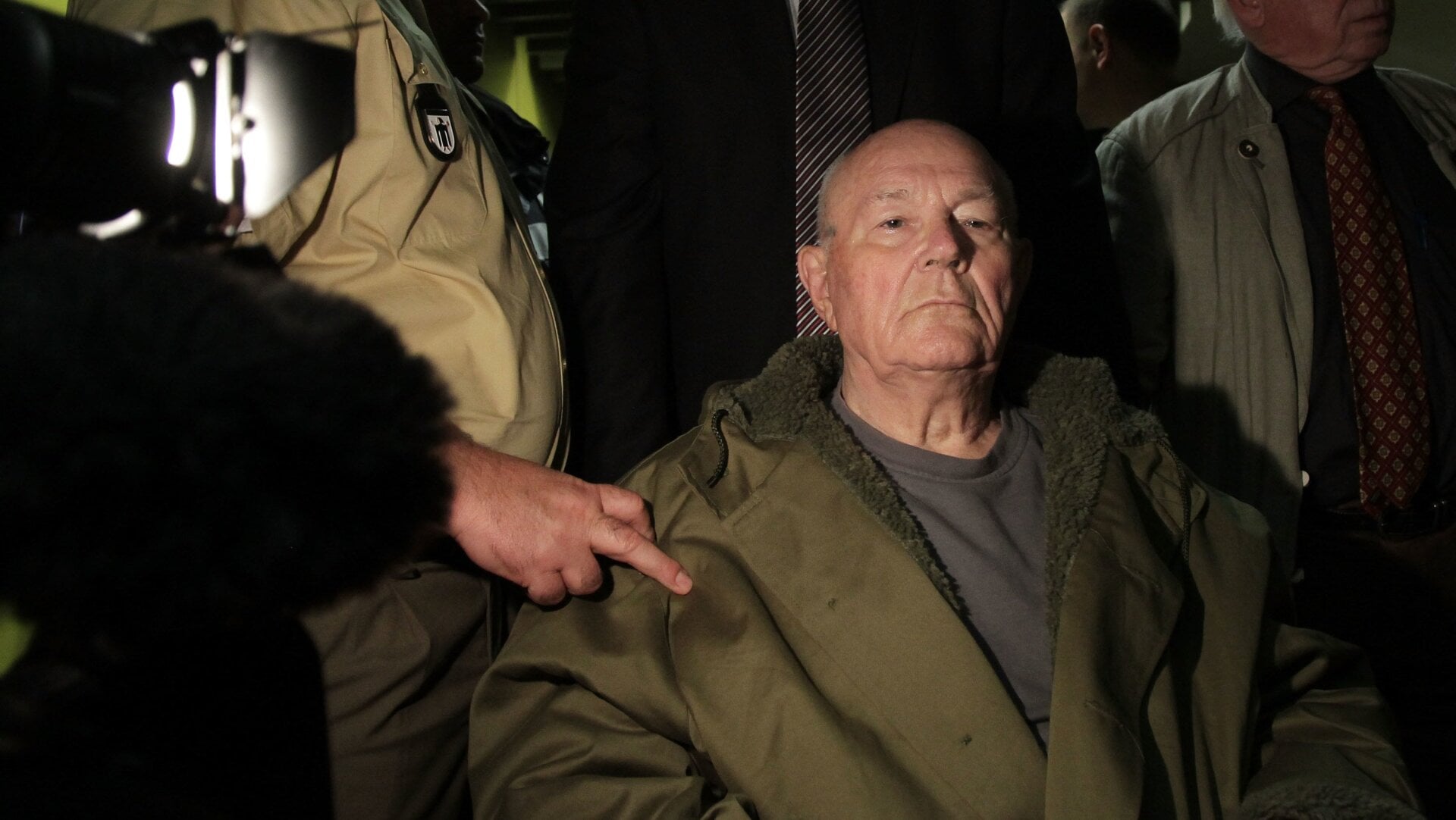 John Demjanjuk leaves a Munich court in May 12, 2011 after being sentenced to five years in prison for charges related to 28,060 counts of accessory to murder.