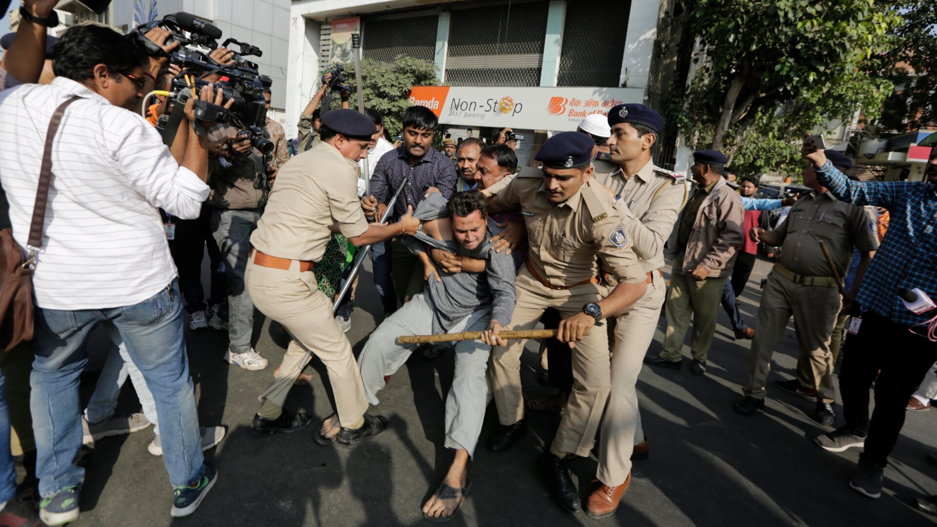 Indian police detain a protester in Ahmadabad, India, on Dec. 19, 2019.