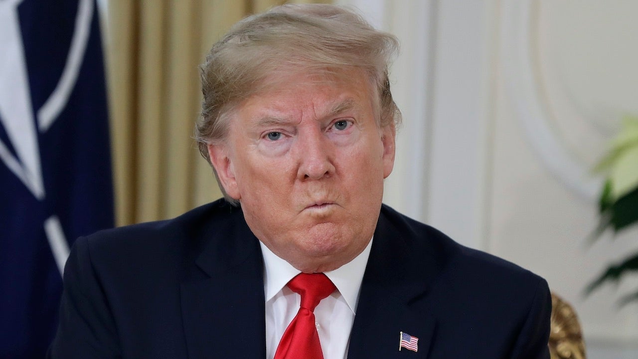 President Donald Trump puckers his lips like an angry toddler in London on December 3, 2019