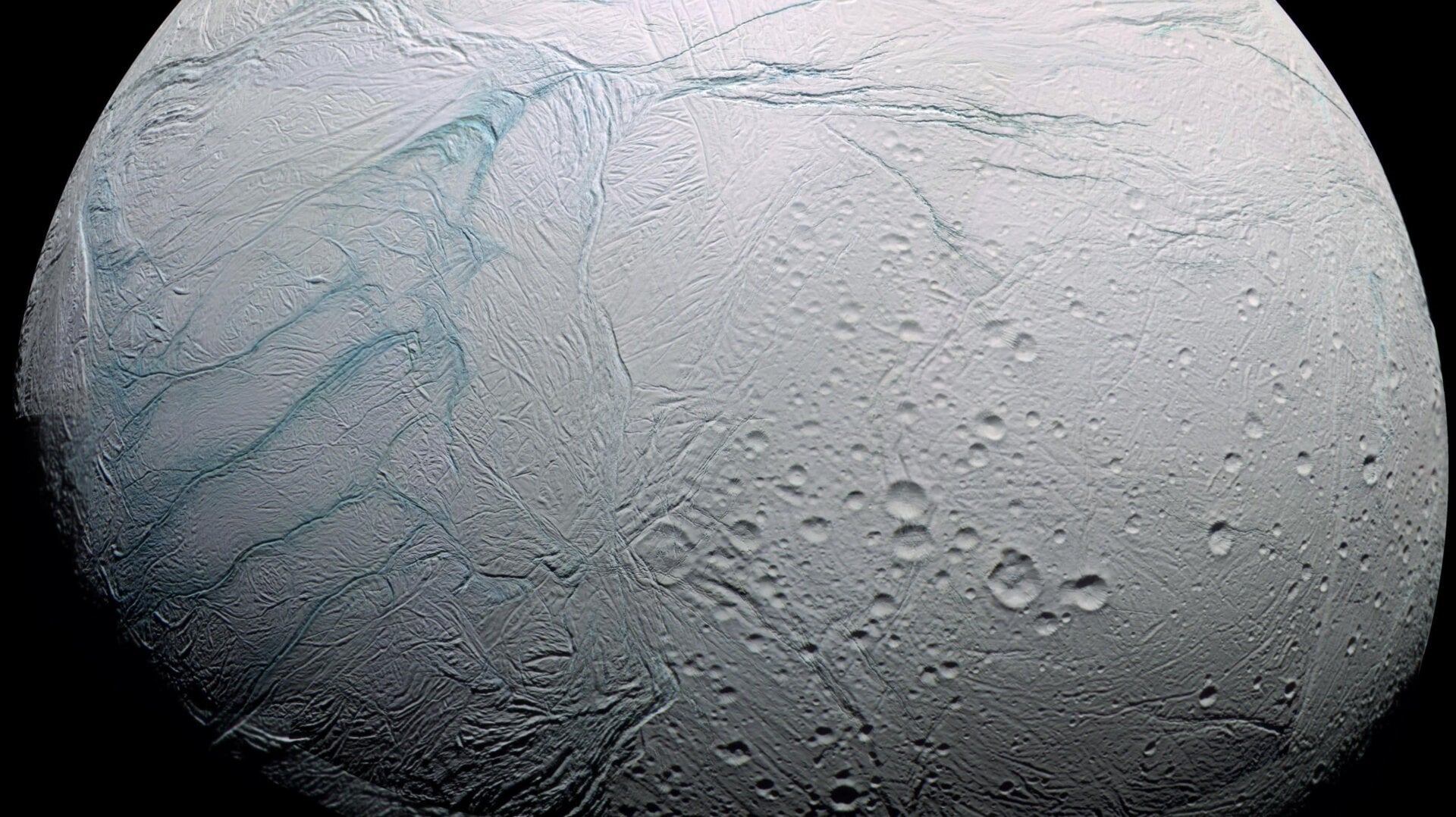 At left, the four tiger stripes at the south pole of Enceladus.