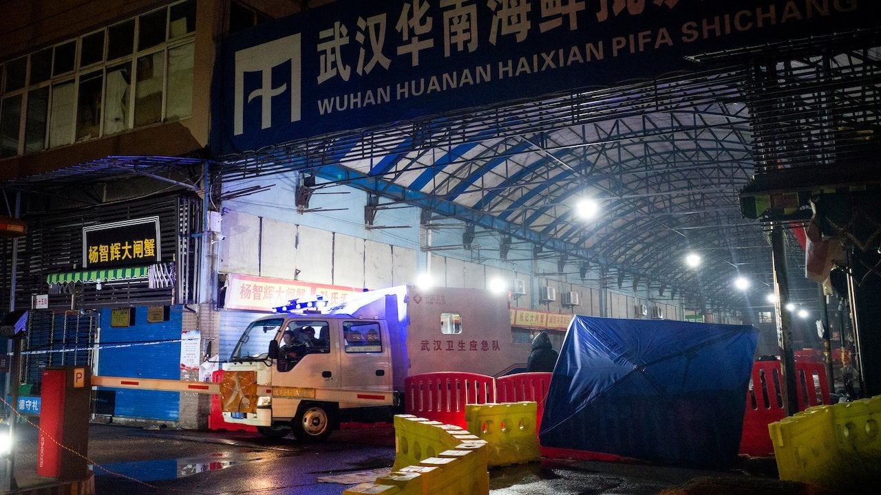 The Wuhan Hygiene Emergency Response Team drives a vehicle as they leave the Huanan Seafood Wholesale Market in the city of Wuhan, in Hubei, Province on January 11, 2020.