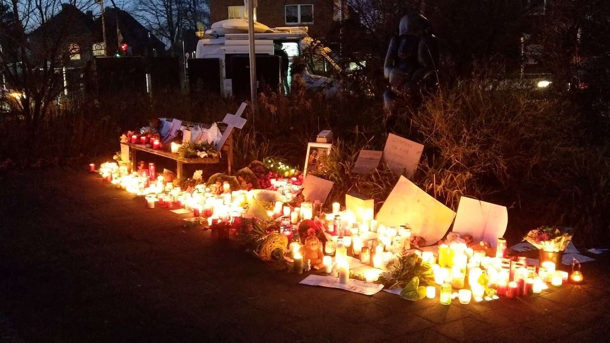 Candles, photos, and other items left by well-wishers outside the Krefeld zoo.