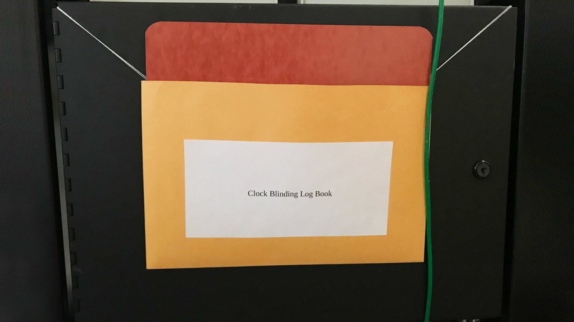 The cabinet door hiding the readout from a secret clock system.