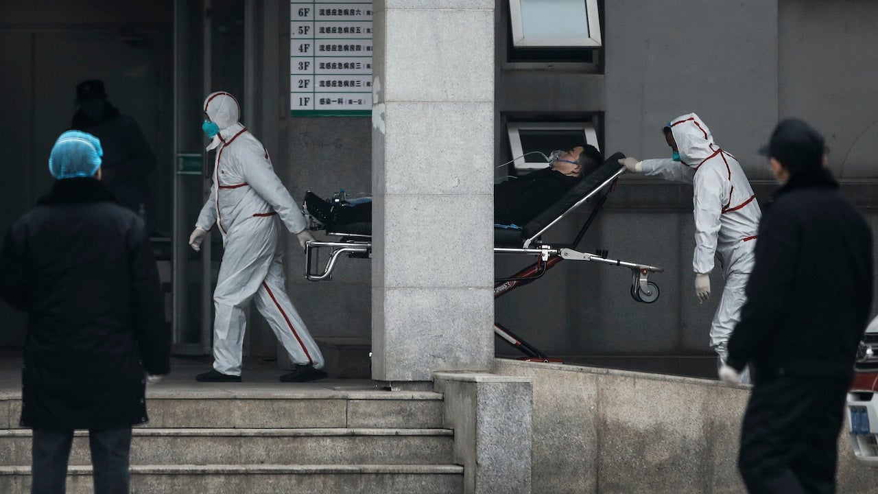 Medical staff transfer patients to Jin Yintan hospital on January 17, 2020 in Wuhan, China
