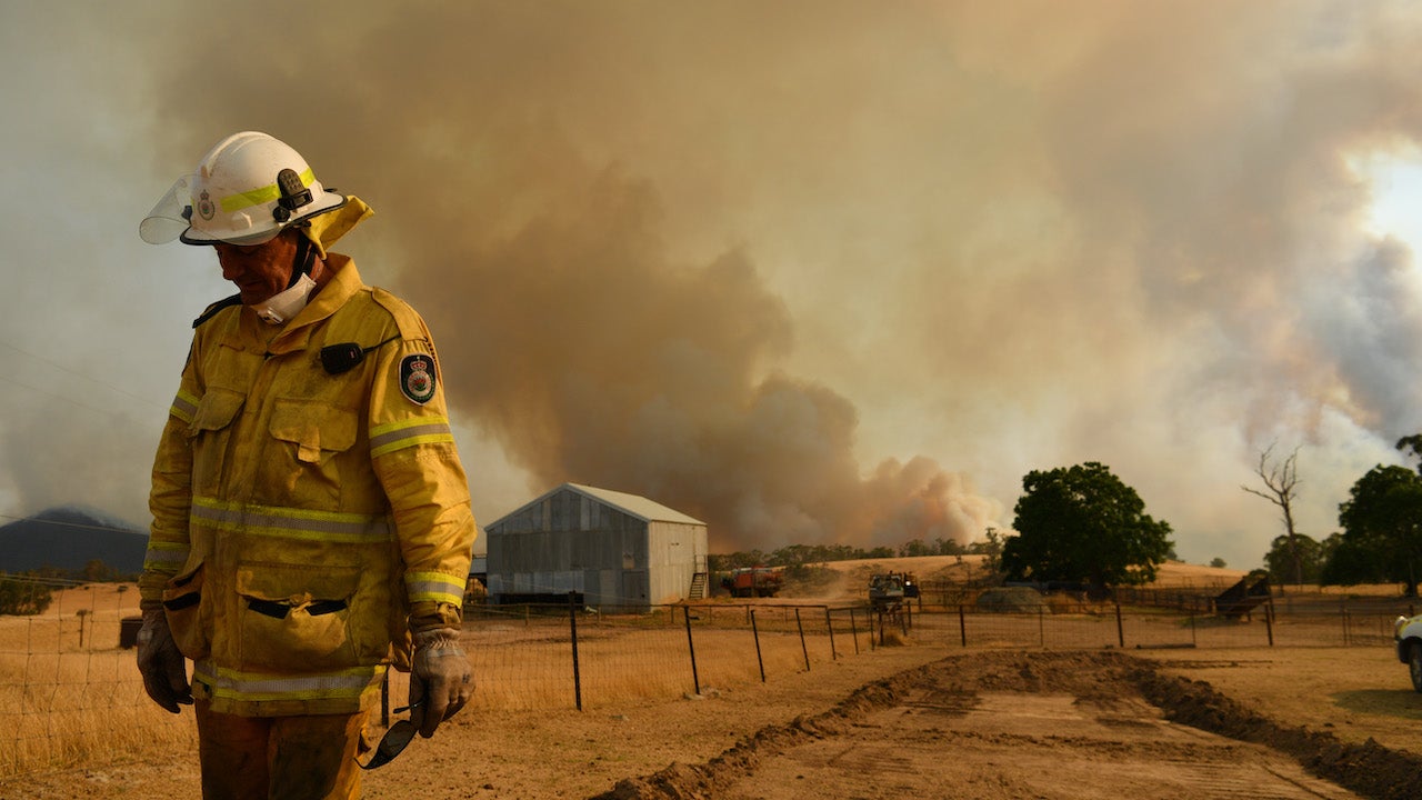 A Rural Fire Service firefighter Trevor Stewart views a flank of a fire on January 11, 2020, in Tumbarumba, Australia.