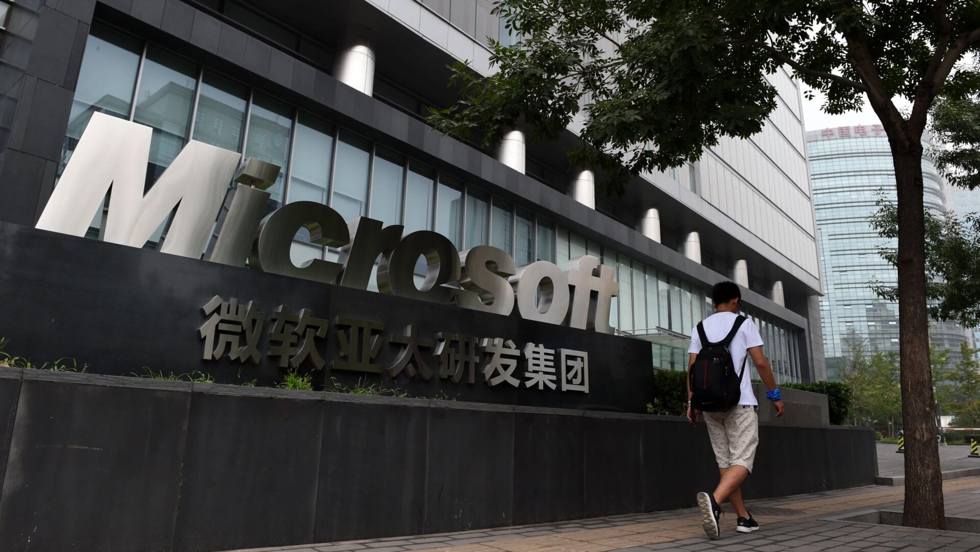 A man walks past Microsoft offices in Beijing in 2014.