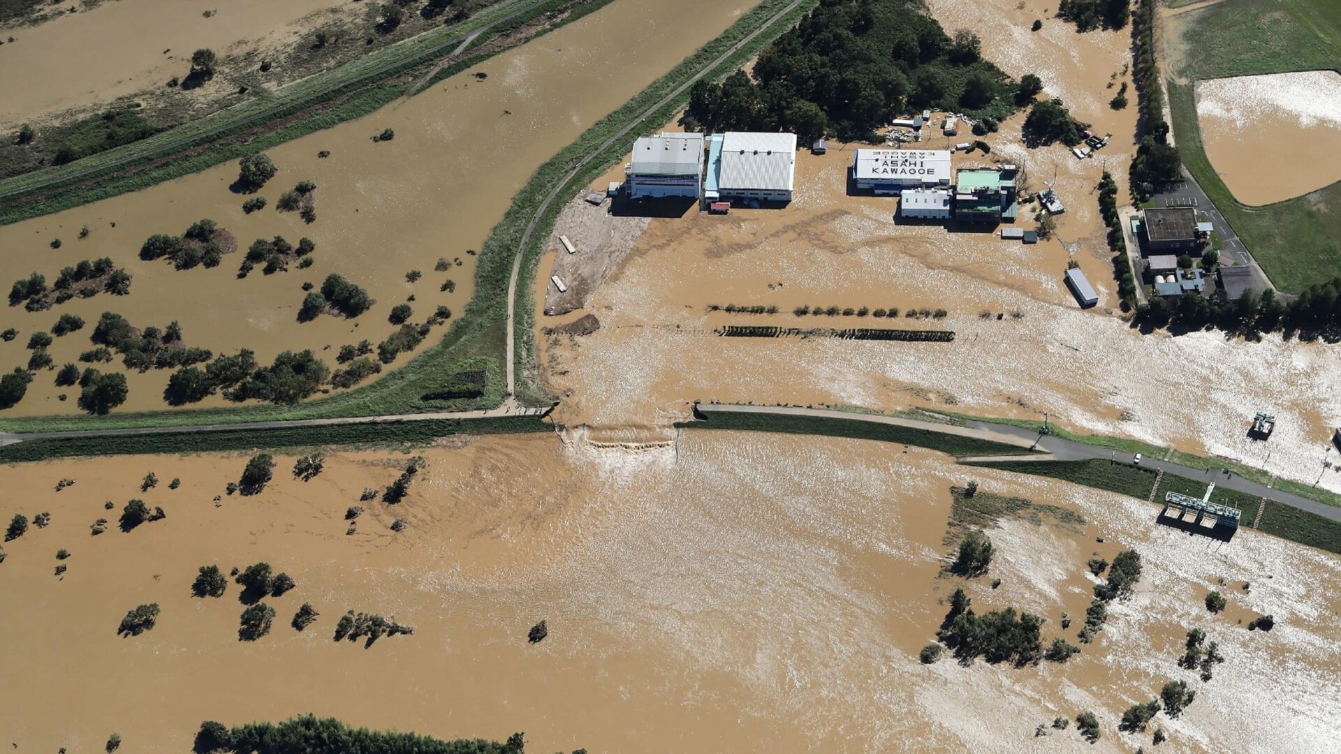 This aerial view shows a flooded area beside the Oppegawa River in Kawagoe, Japan, on October 13, 2019, one day after Typhoon Hagibis left at least 15 people dead.