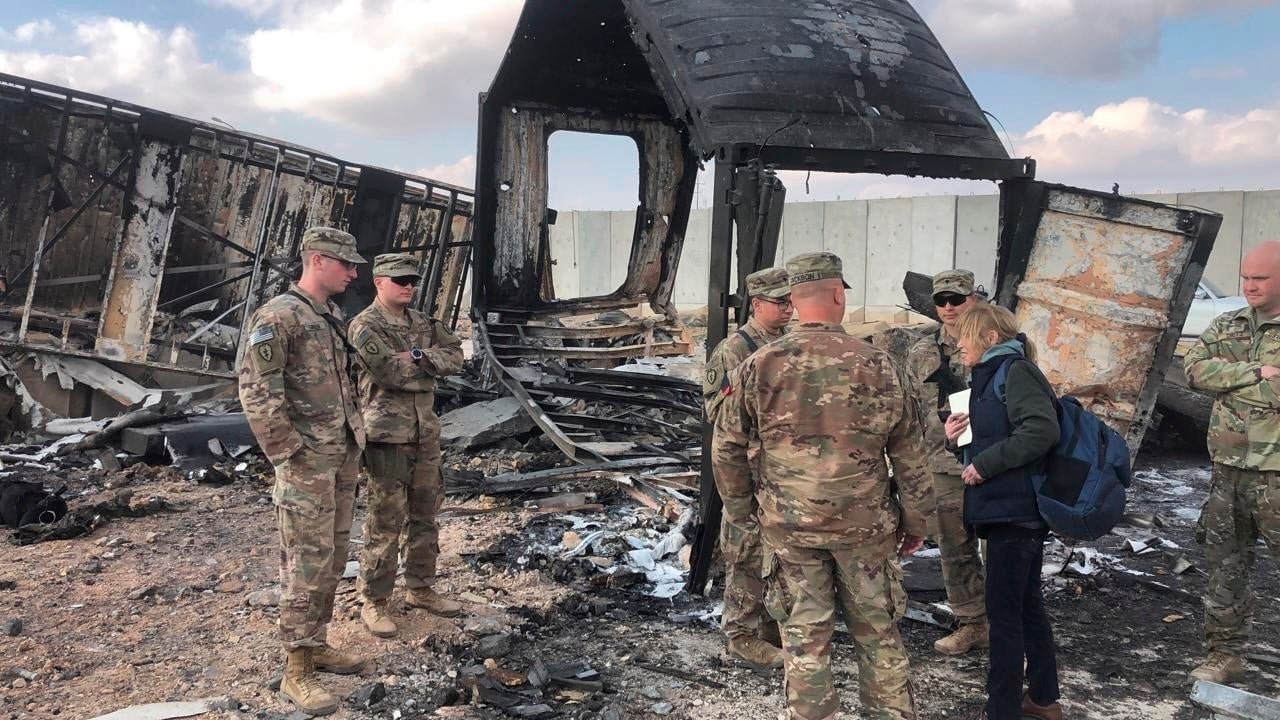 U.S. troops review damage to Ain Al-Asad air base from an Iranian missile strike earlier this month.