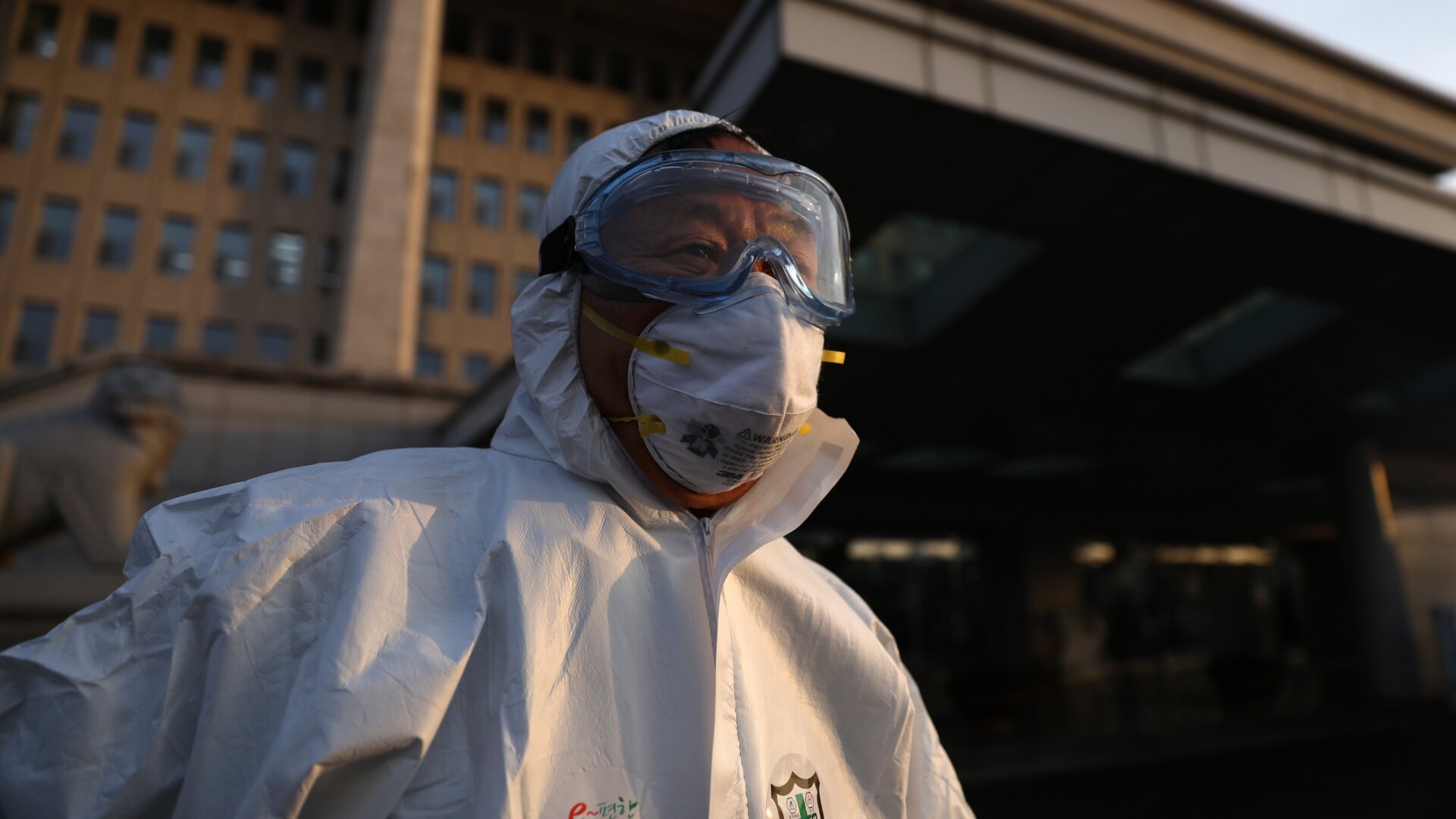 A health care worker in South Korea preparing to disinfect the National Assembly building in Seoul