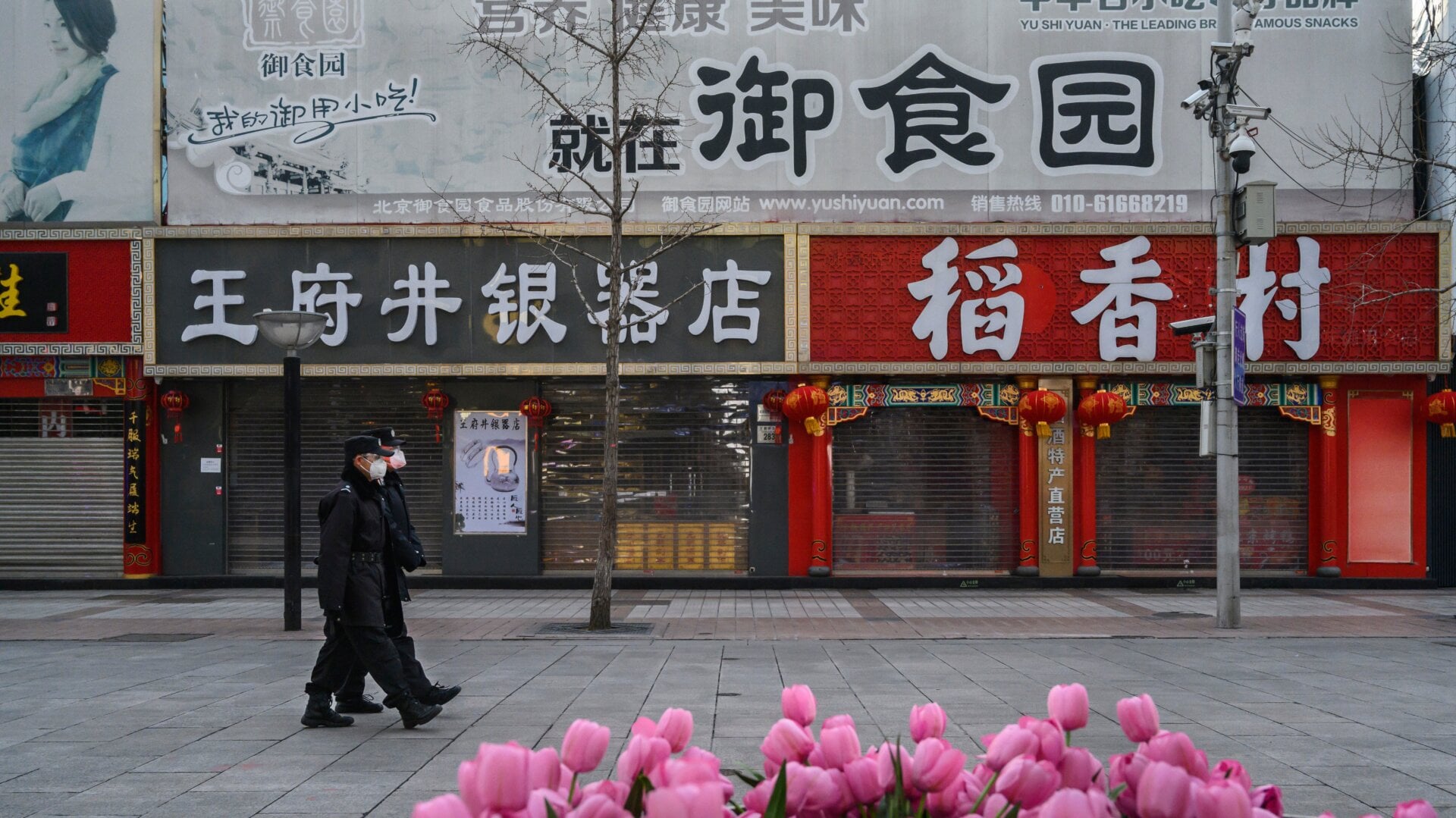 Chinese security personnel wear masks in Beijing on Feb. 18, 2020.