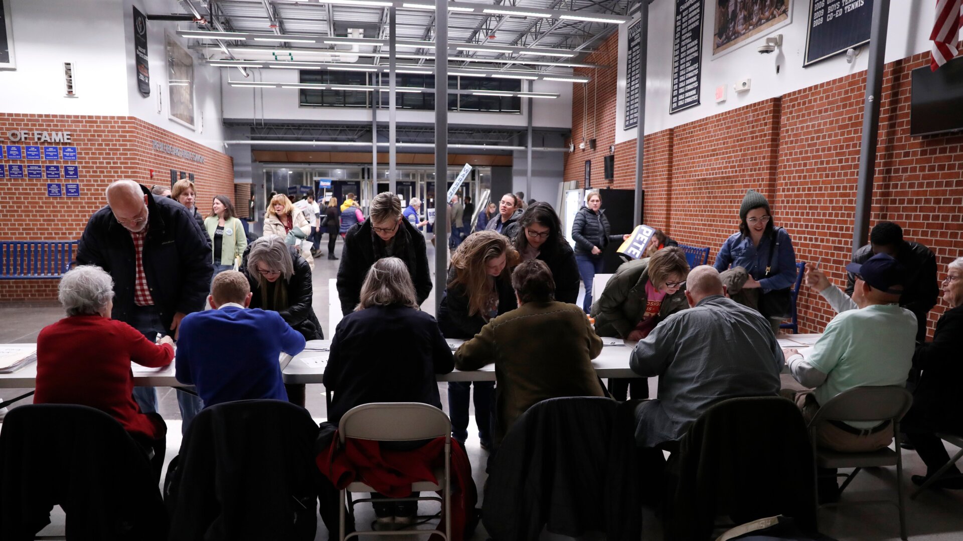 Attendees arrive at the Iowa Democratic caucuses at a school in Des Moines, Iowa.