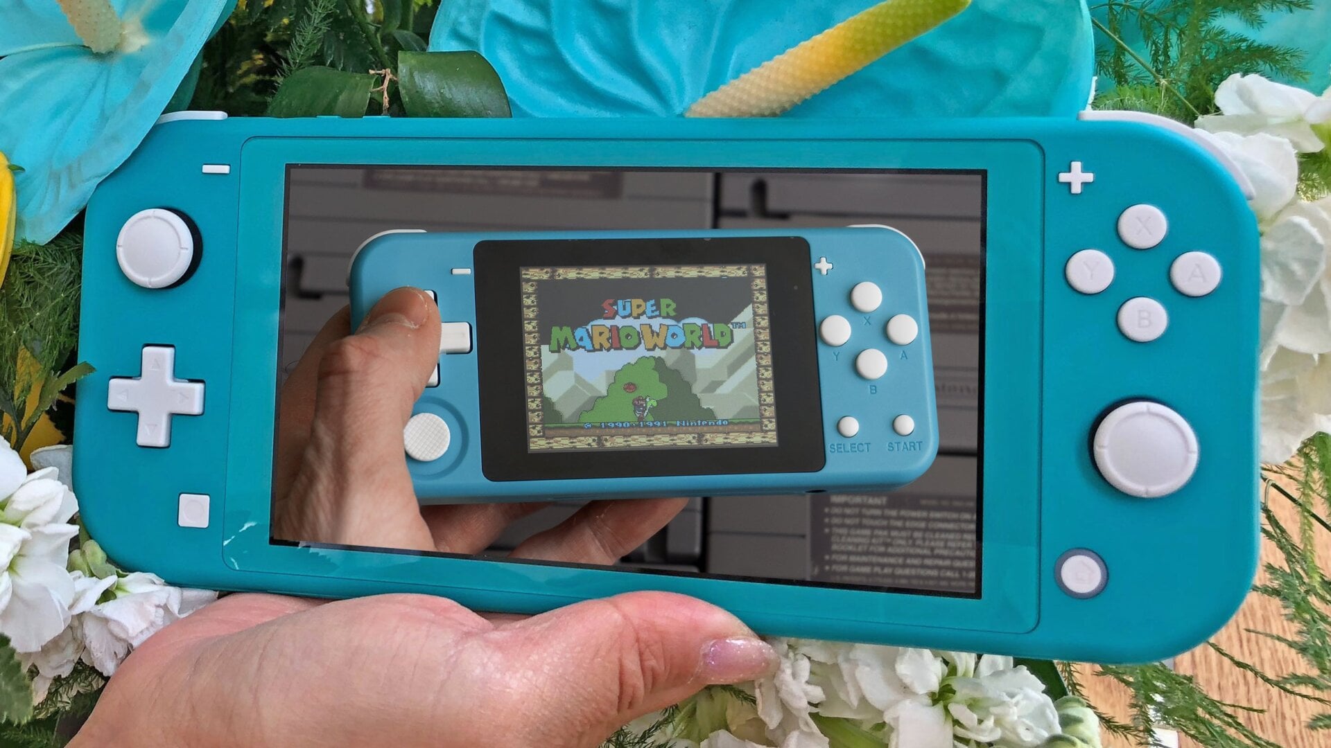 There’s no denying where the makers of the Powkiddy Q90 drew their design inspiration from for the tiny console.