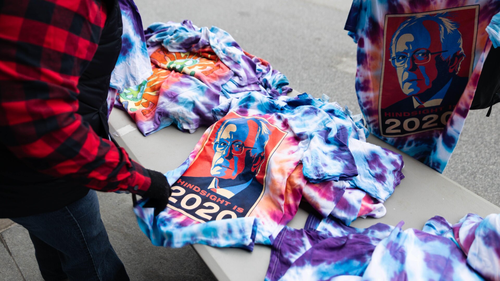 Supporters of Democratic presidential candidate Vermont Senator Bernie Sanders continue to buy merchandise outside of Huntington Center in Cleveland, Ohio after a rally was cancelled for COVID-19 (Coronavirus) concerns on March 10, 2020.