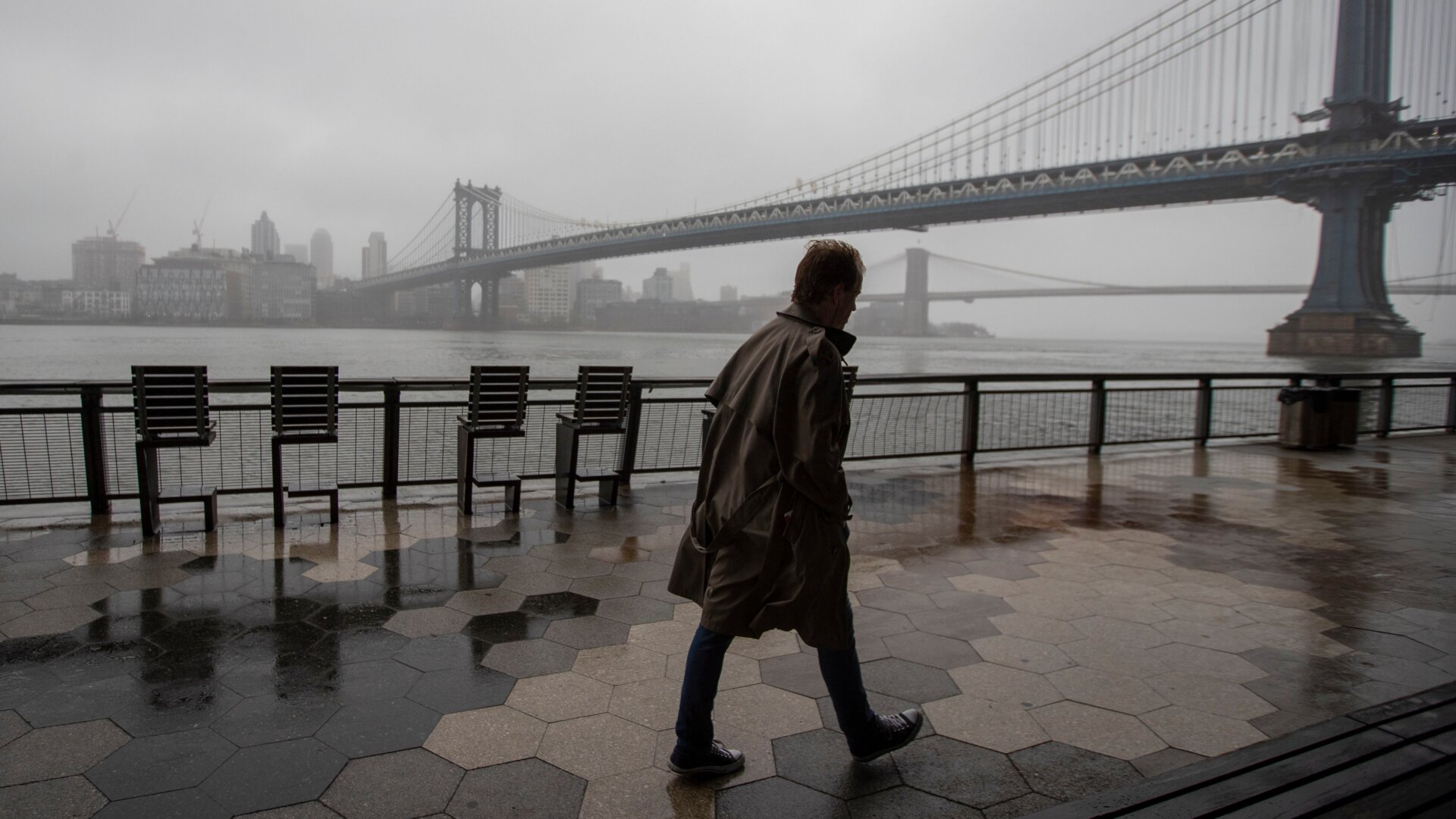 A man walks alone on the promenade under the FDR drive in Lower Manhattan, Sunday, March 29, 2020.